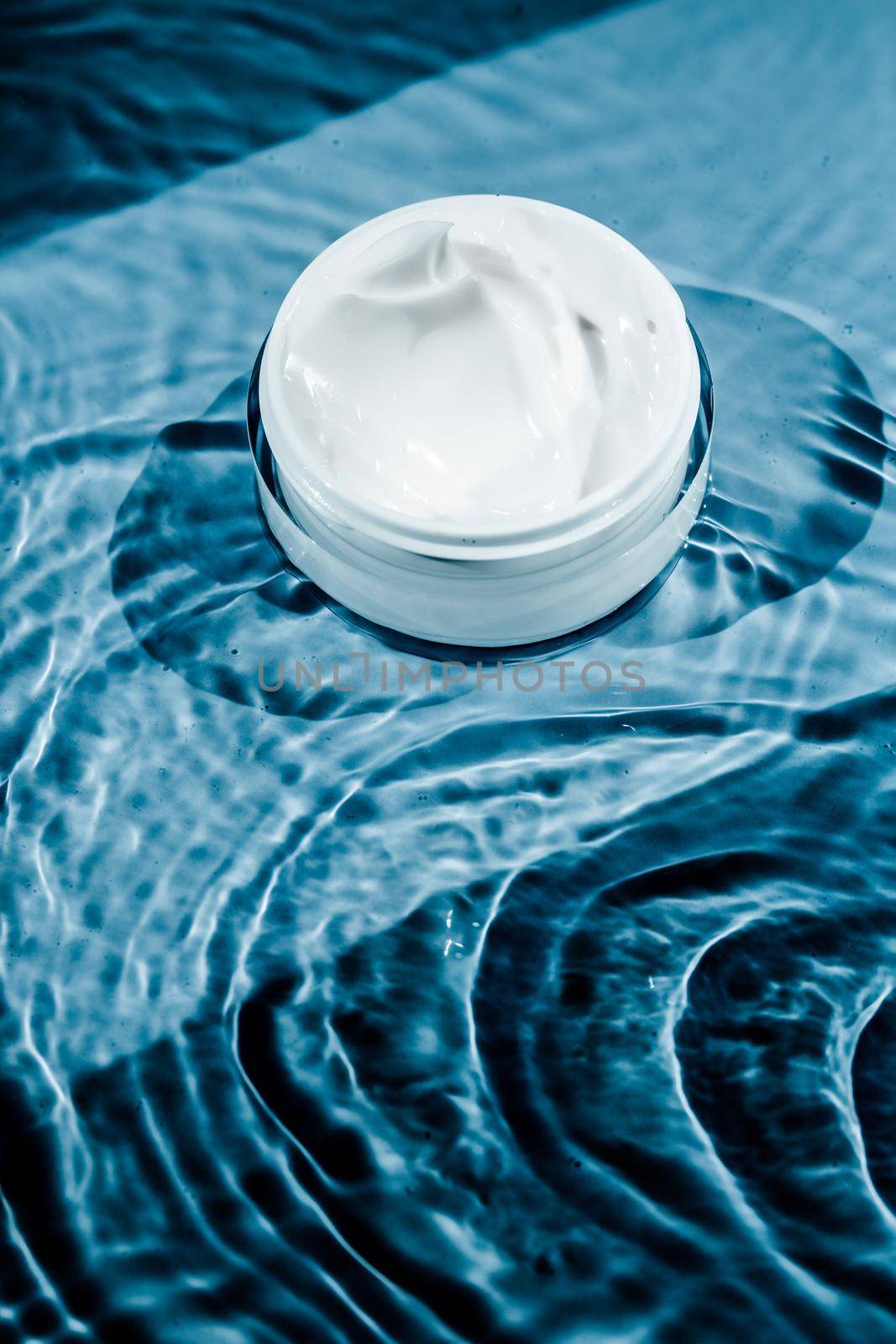 Sensitive skincare moisturizer cream on water background - clean beauty, cosmetic products and luxury body care concept. Natural science for your skin