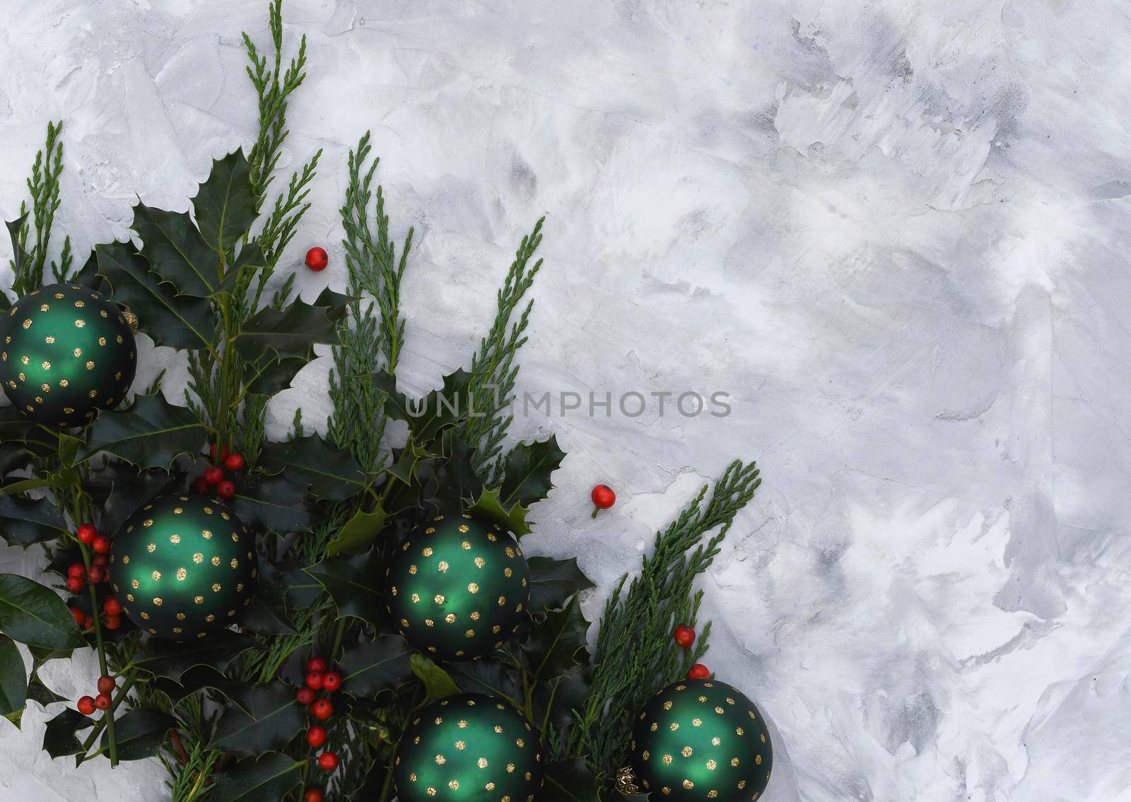 Christmas or new year table decor with fir branches, holly branches with berries by KaterinaDalemans
