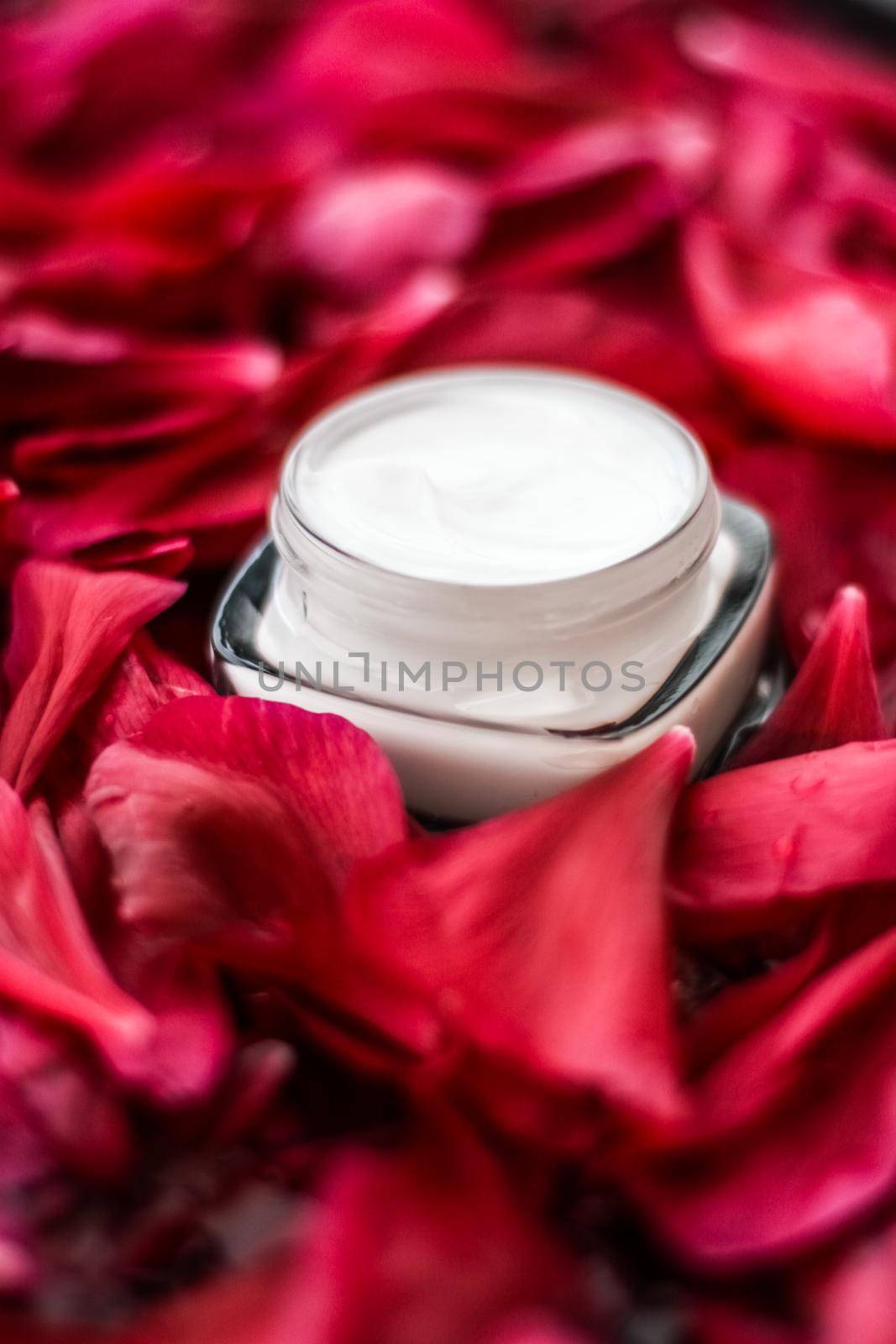 Clean beauty, cosmetic products and luxury body care concept - Sensitive skincare moisturizer cream on red flower petals and water background, natural science for skin