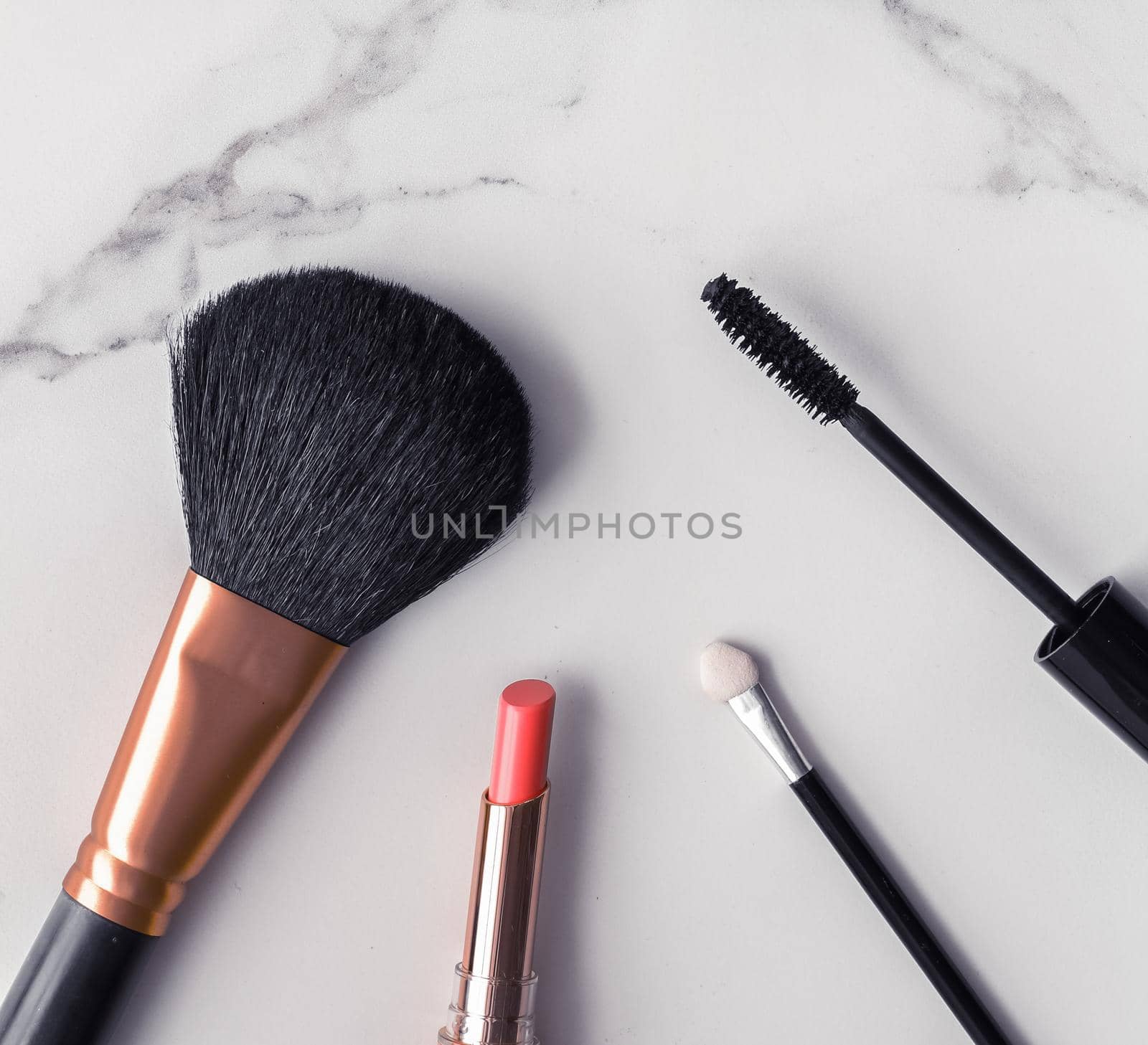 Make-up and cosmetics flatlay on marble by Anneleven