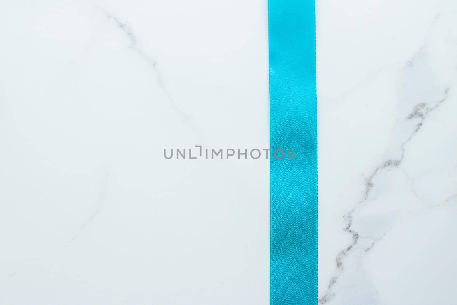 Holiday decor, feminine design and flatlay concept - Blue silk ribbon on marble, top view