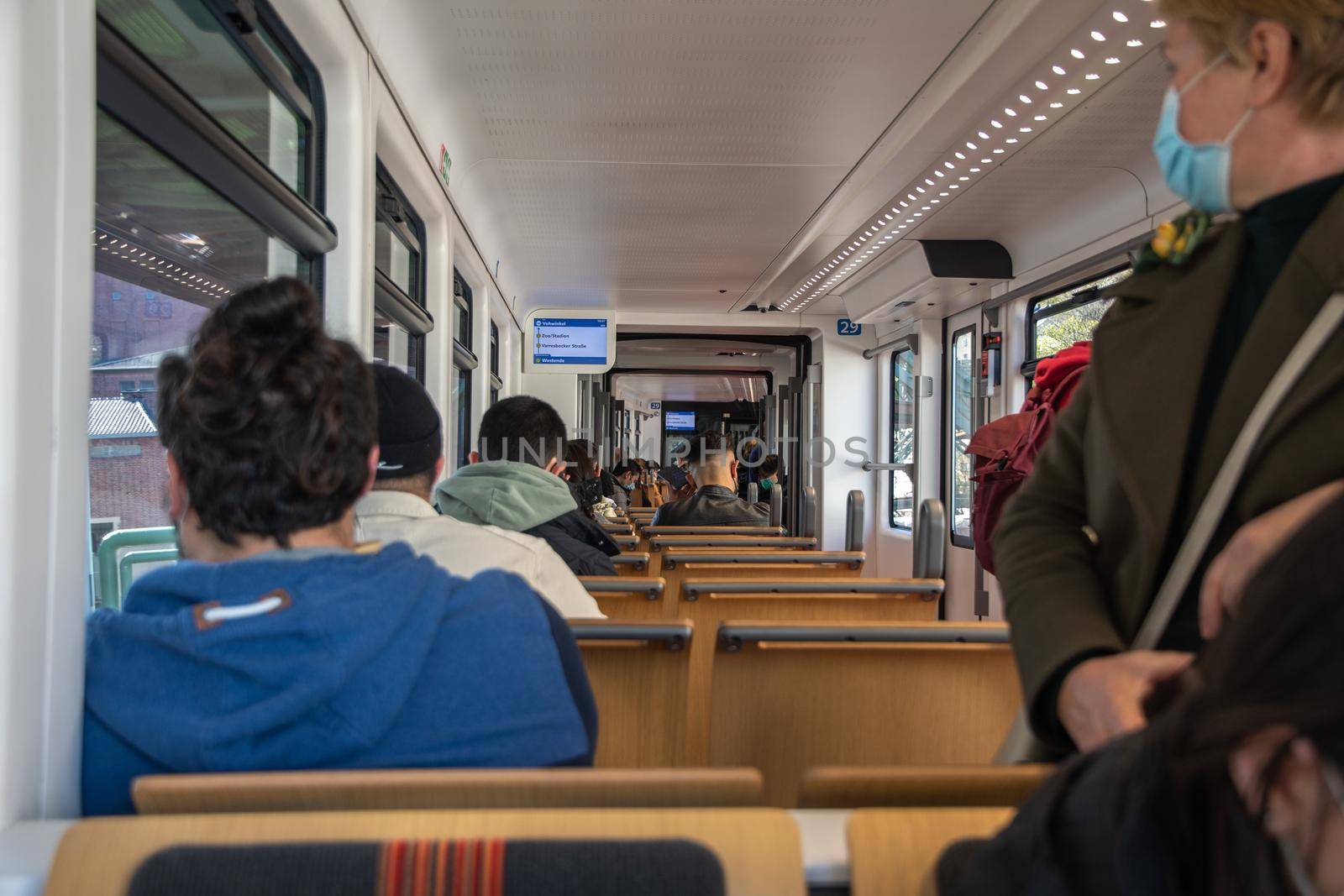 Passengers ride in a suspended carriage on the Wuppertal suspended tram in Germany. The unique electric monorail system is a landmark. High quality photo