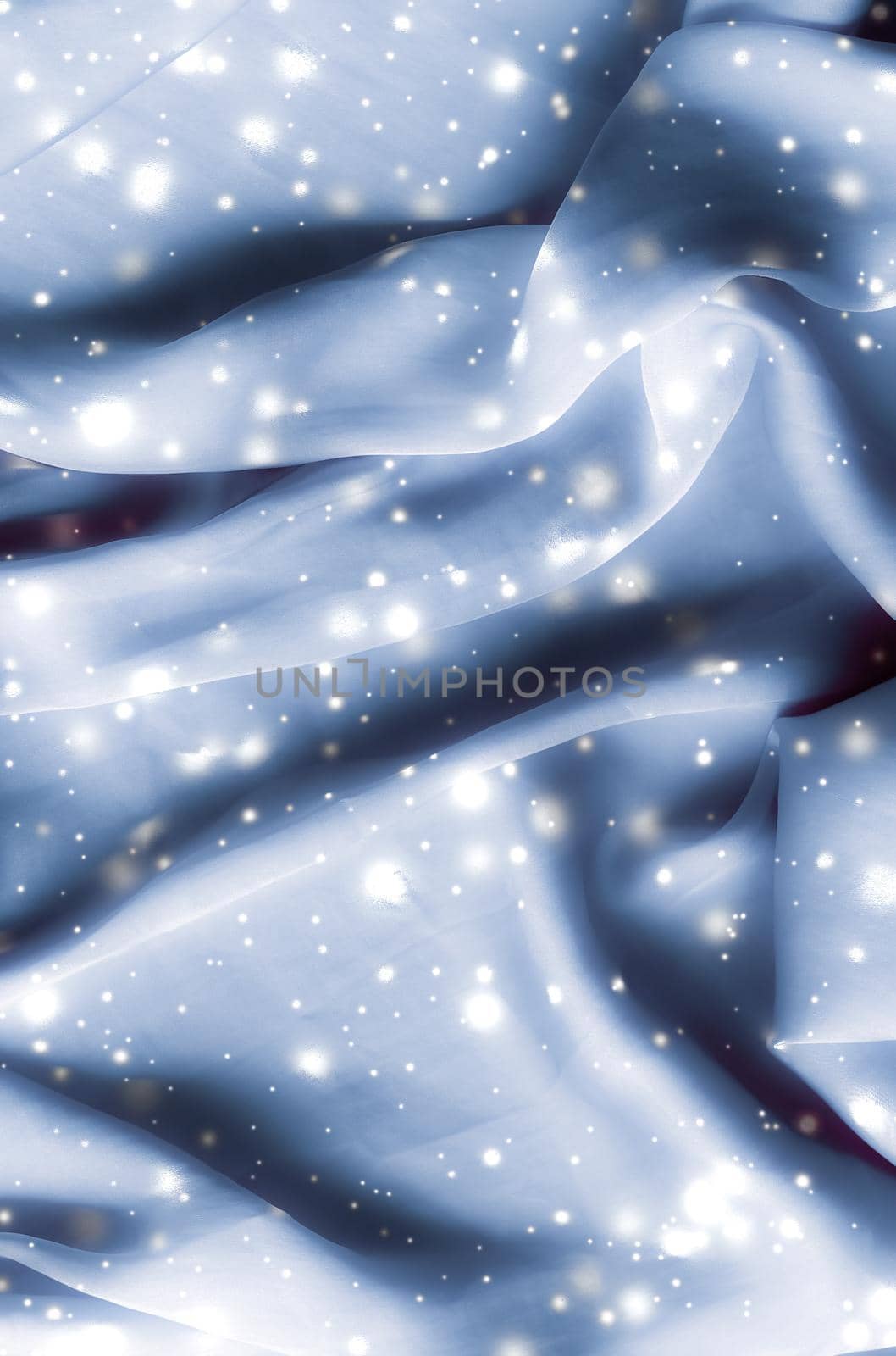 Winter fashion, shiny fabric and glamour style concept - Magic holiday blue soft silk flatlay background texture with glowing snow, luxury beauty abstract backdrop