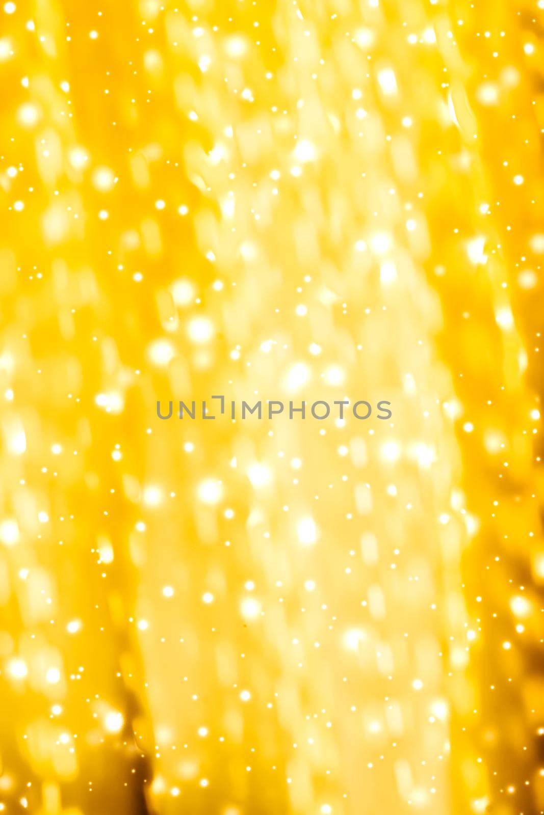 Golden Christmas lights, New Years Eve fireworks and abstract texture concept - Glamorous gold shiny glow and glitter, luxury holiday background