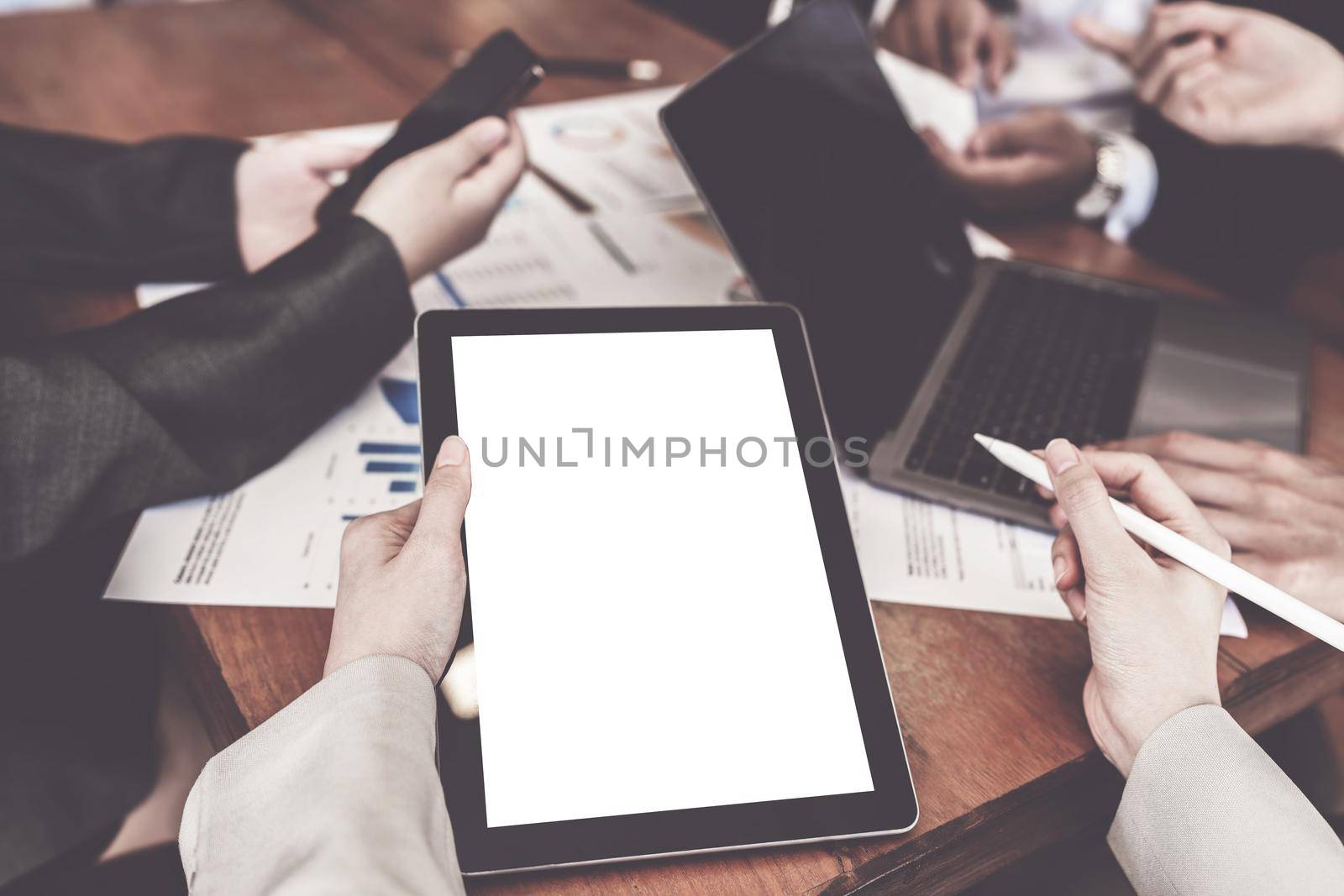 Business person and Accountant using tablet with blank screen at meeting room.