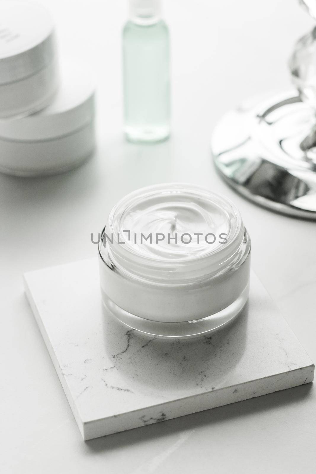 Luxury skincare cosmetics in a bathroom by Anneleven