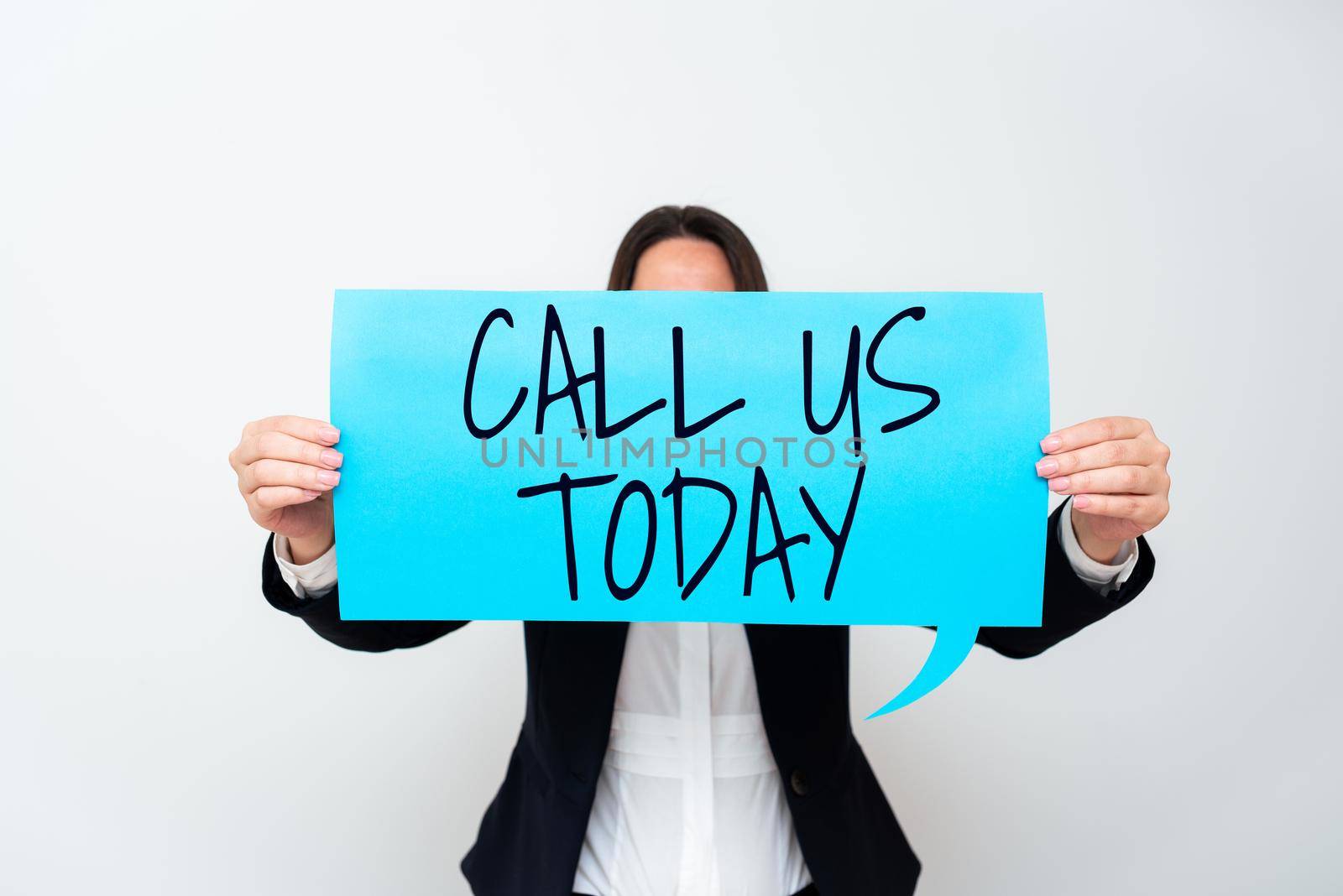 Text sign showing Call Us Today. Business approach Make a telephone calling to ask for advice or support Important Messages Presented On Piece Of Paper On Desk With Books. by nialowwa