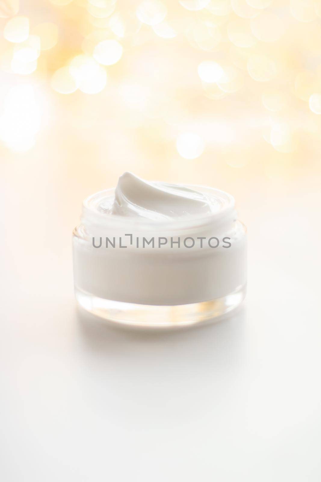 Beauty, anti-age cosmetics and skincare concept - Luxury face cream jar and holiday glitter