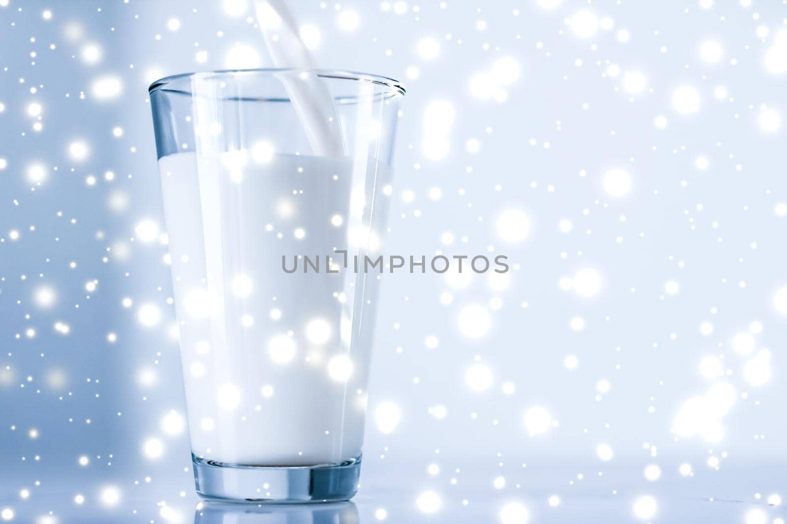 Dairy products, healthy diet and Christmas food concept - Magic holiday drink, pouring organic lactose free milk into glass on marble table