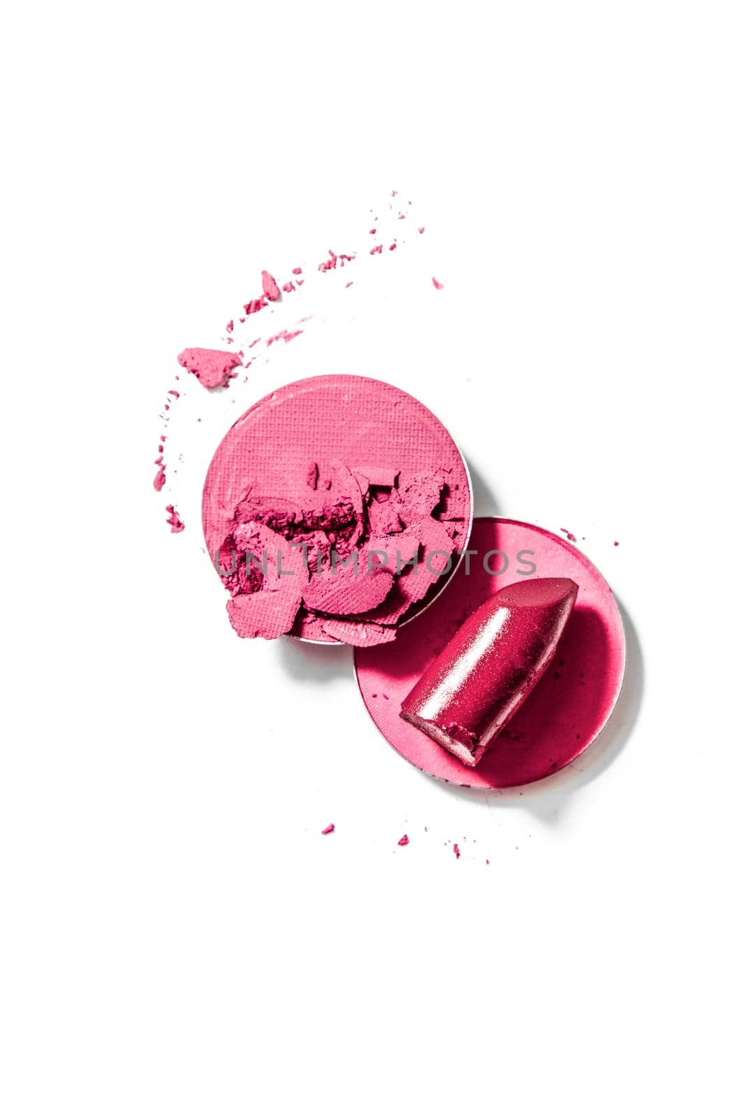 Crushed eyeshadows and lipstick isolated on white background by Anneleven
