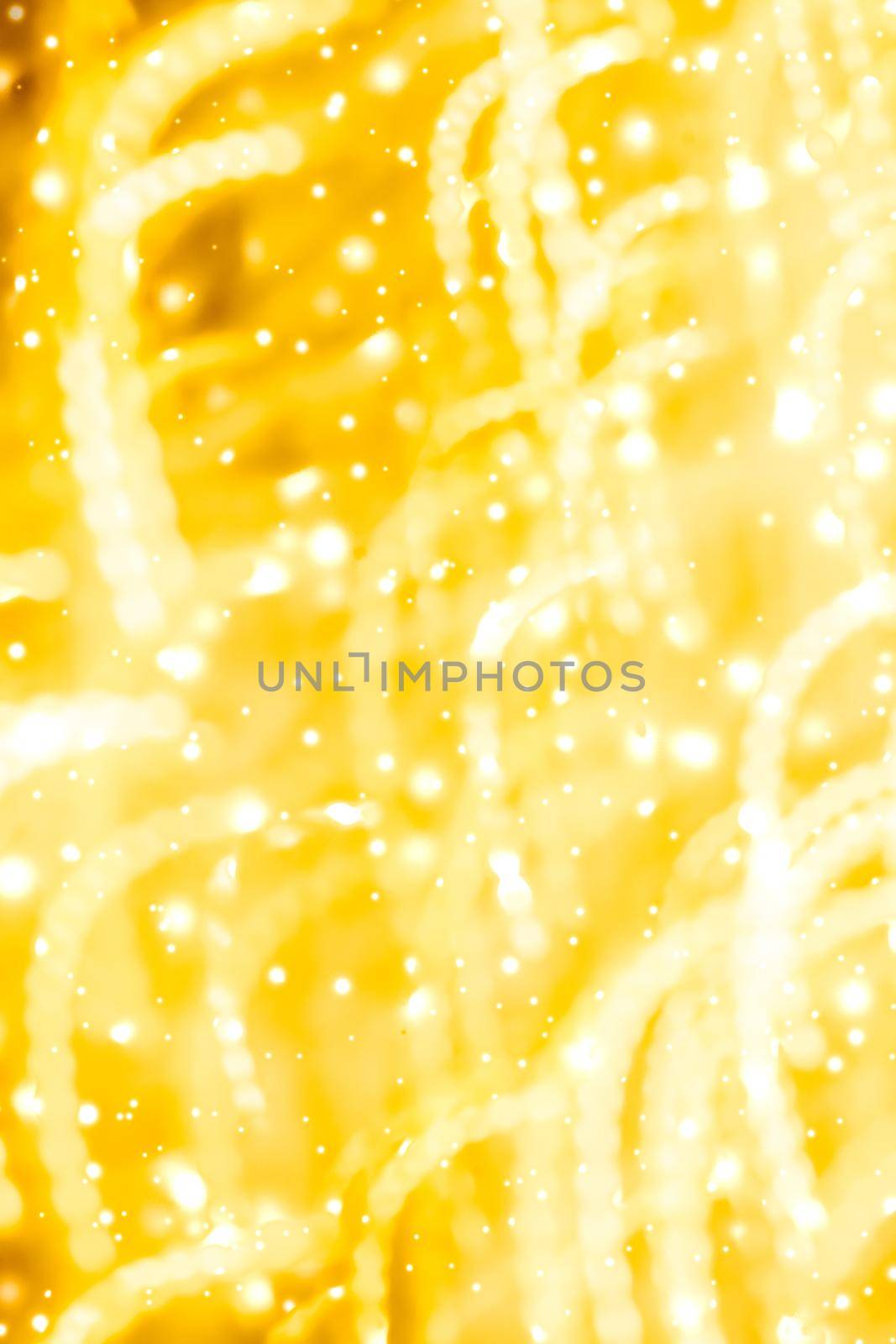 Golden Christmas lights, New Years Eve fireworks and abstract texture concept - Glamorous gold shiny glow and glitter, luxury holiday background