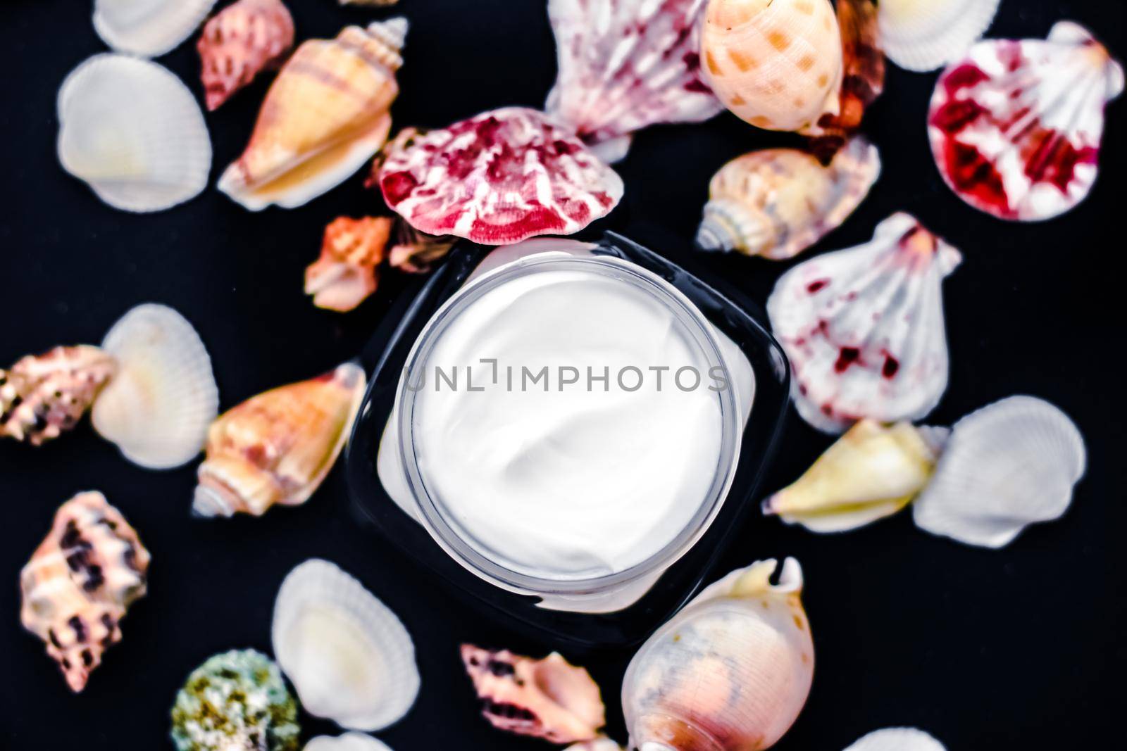 Sensitive skincare moisturizer beauty face cream on water and sea shells background, luxury anti-age cosmetics by Anneleven