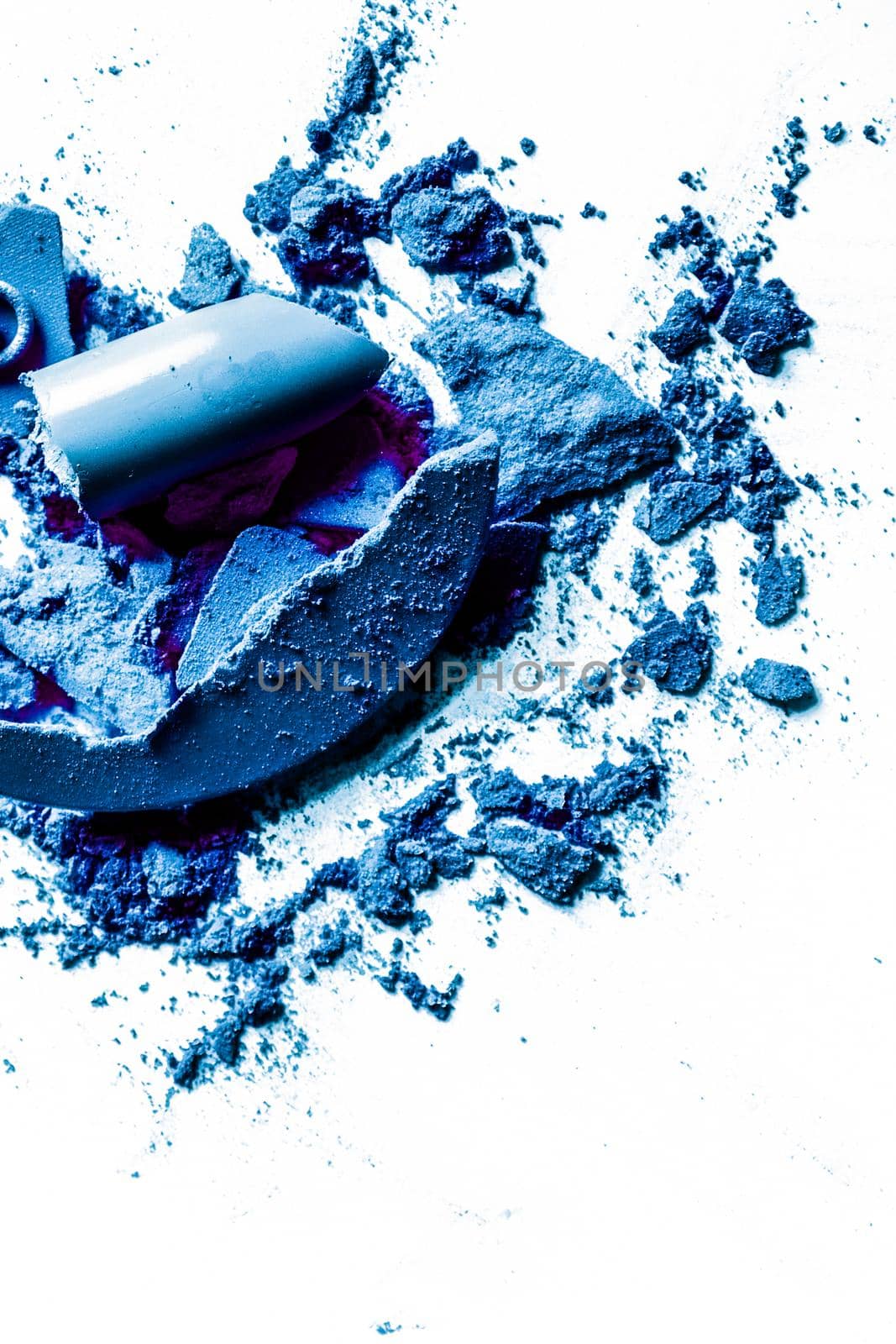 Crushed eyeshadows, lipstick and powder isolated on white background by Anneleven