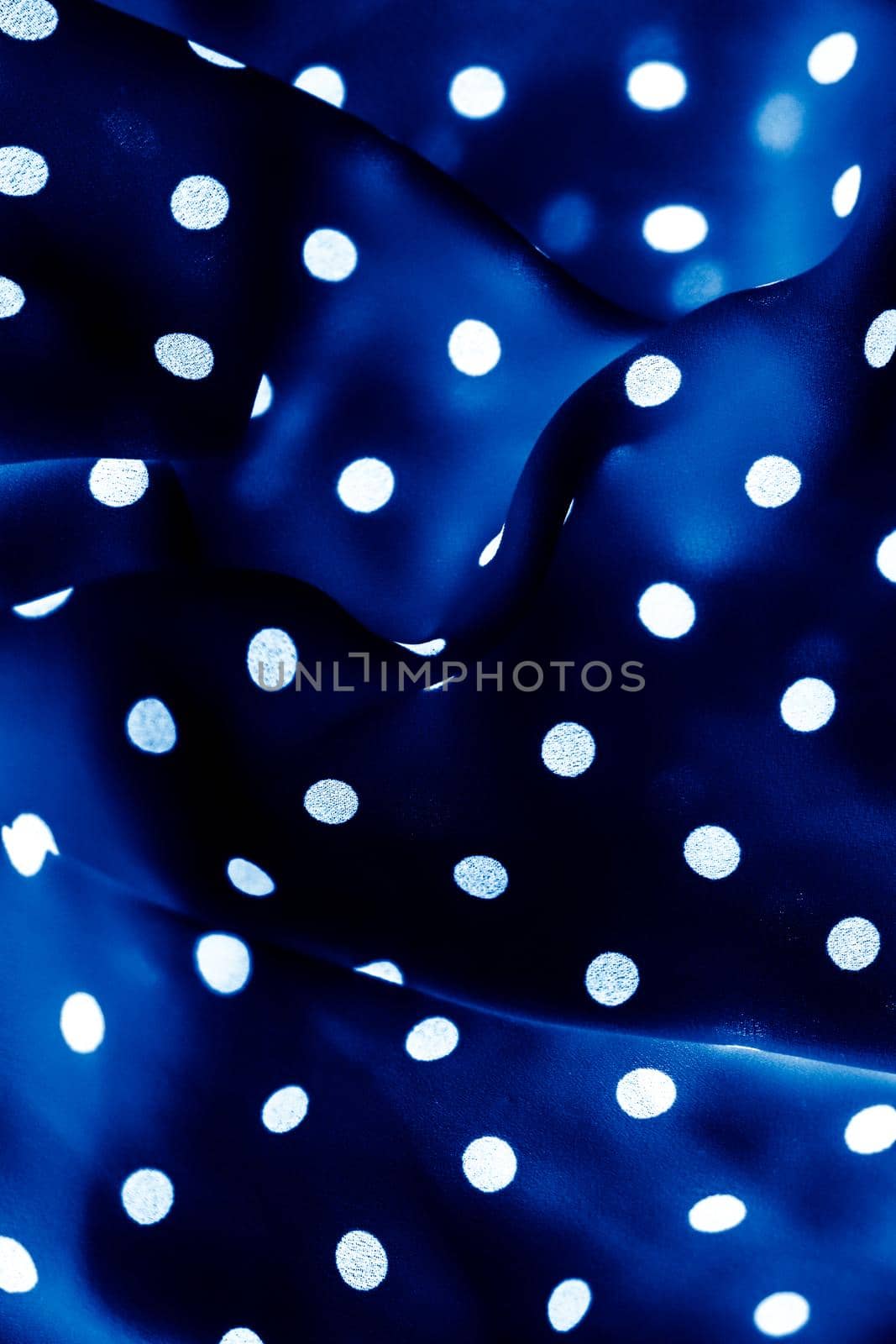 Fashion design, interior decor and vintage material concept - Classic polka dot textile background texture, white dots on blue luxury fabric design pattern