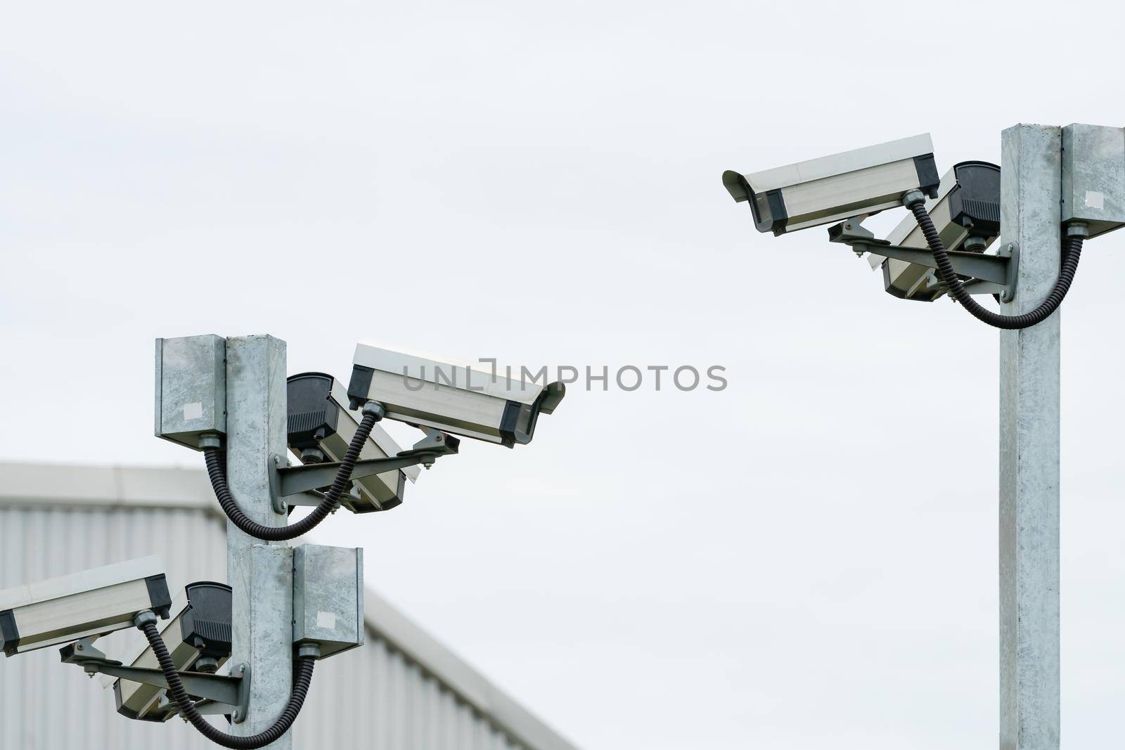 CCTV security camera video system for safety installed outside the warehouse of factory building. Closed circuit television . CCTV electronic security system. Video surveillance camera technology.  