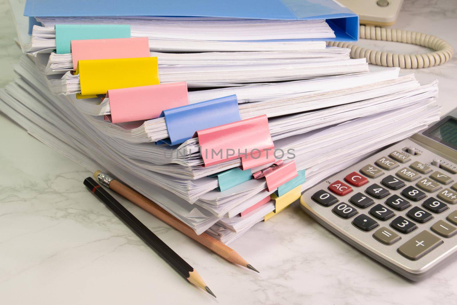 document paper of business report paper file on the table with pencil and calculator, concept document in work office by piyaphun