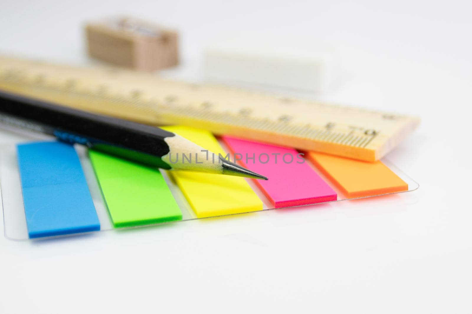 close up a pencil with paper color note on white background