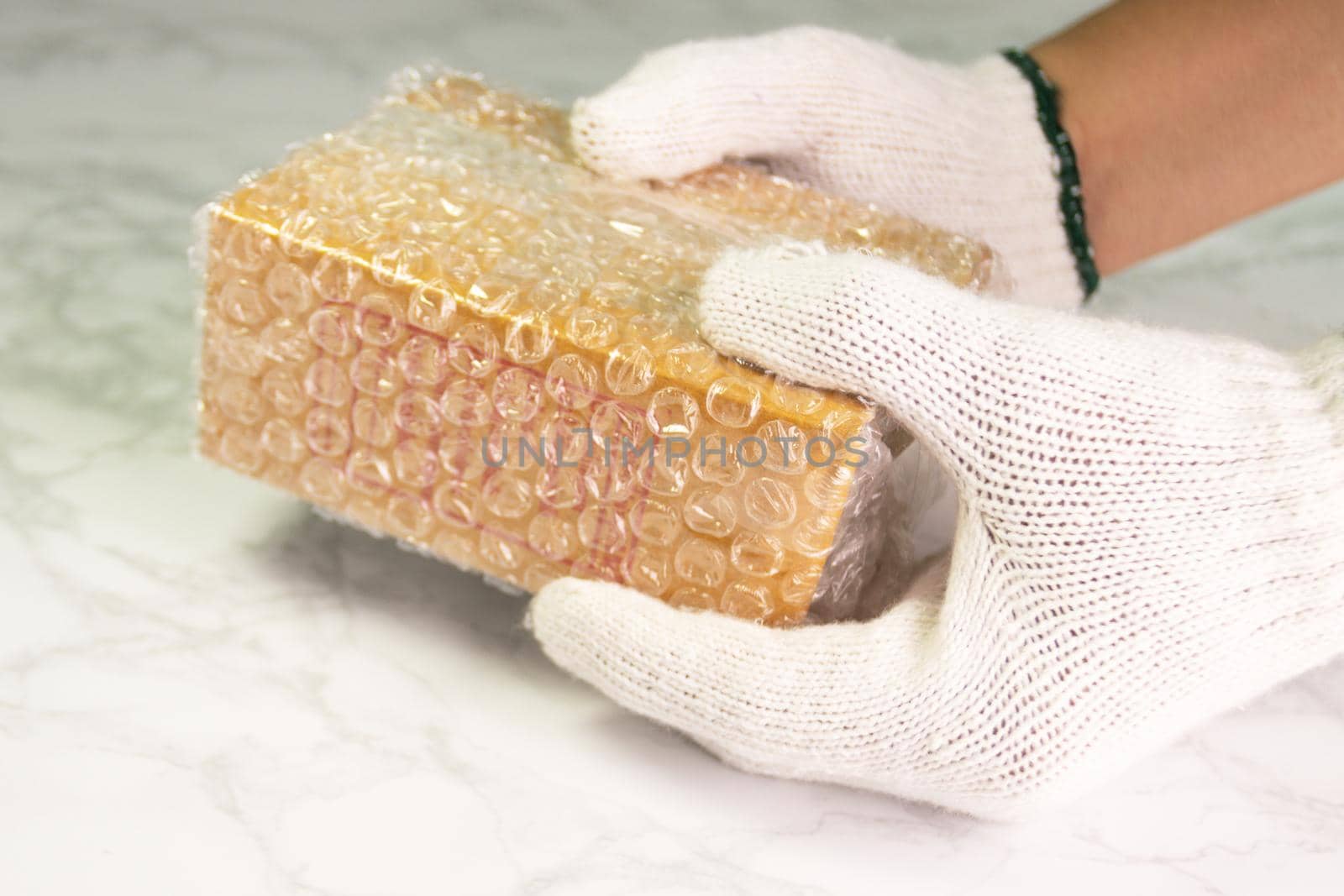 hand of man hold bubble wrap, for protection parcel product cracked or insurance During transit  