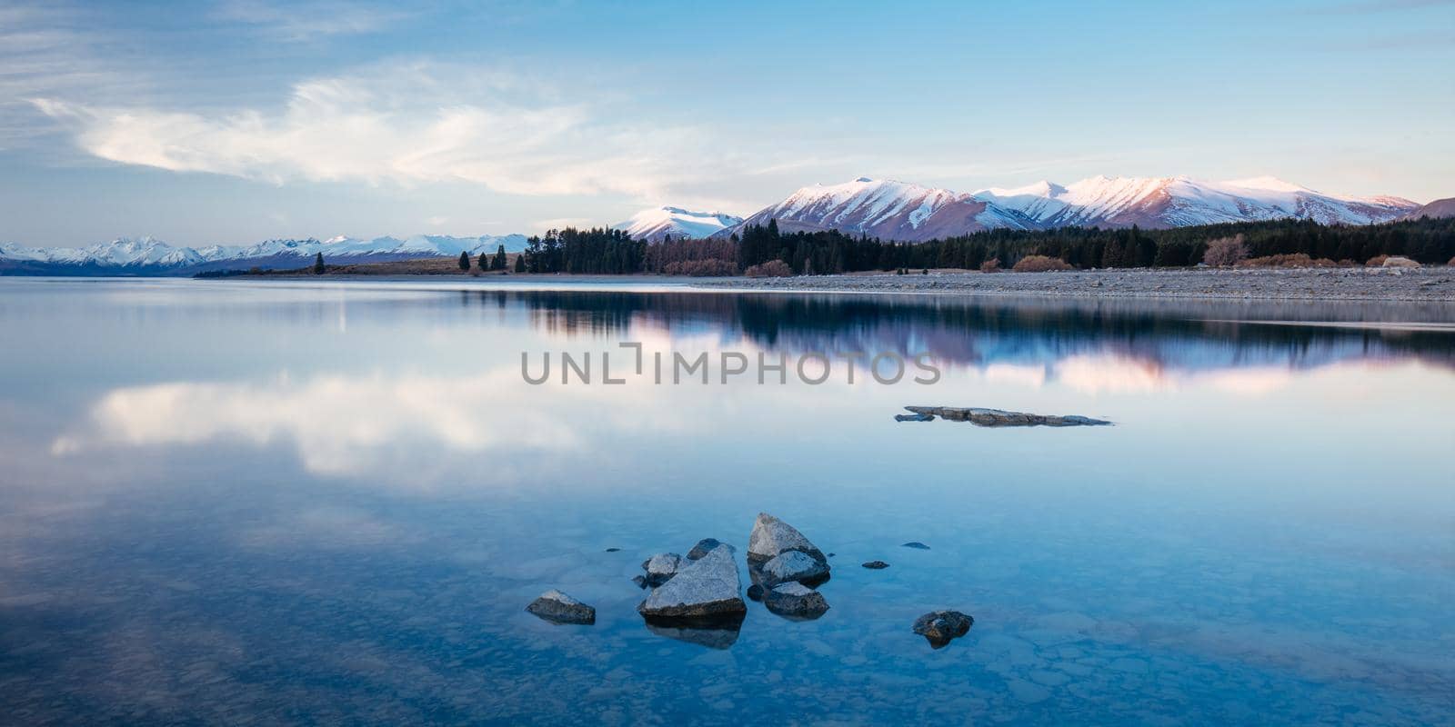 Majestic Lake Tekapo at sunset on a cool spring evening in New Zealand