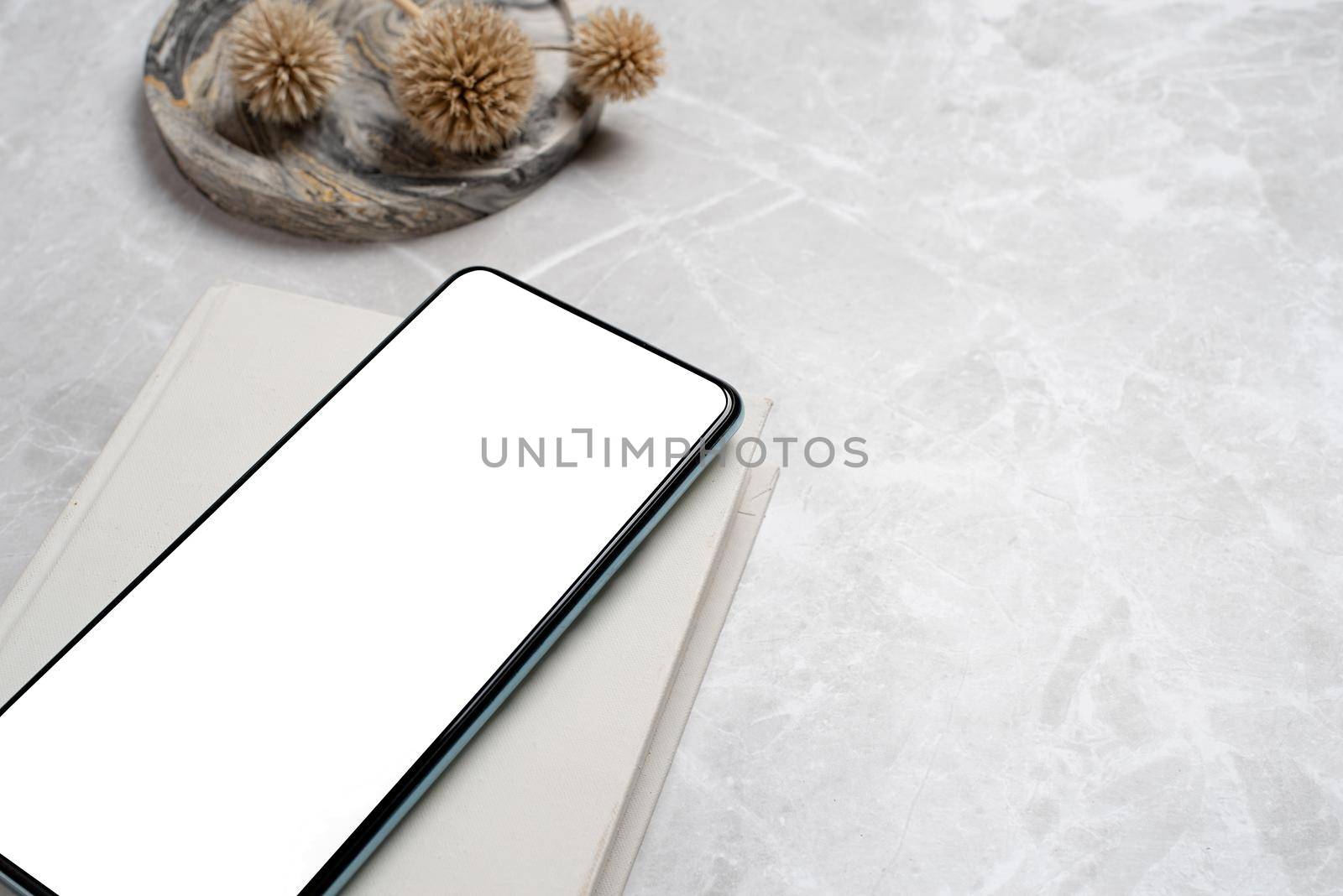 smartphone with isolated screen on marble desk by Desperada