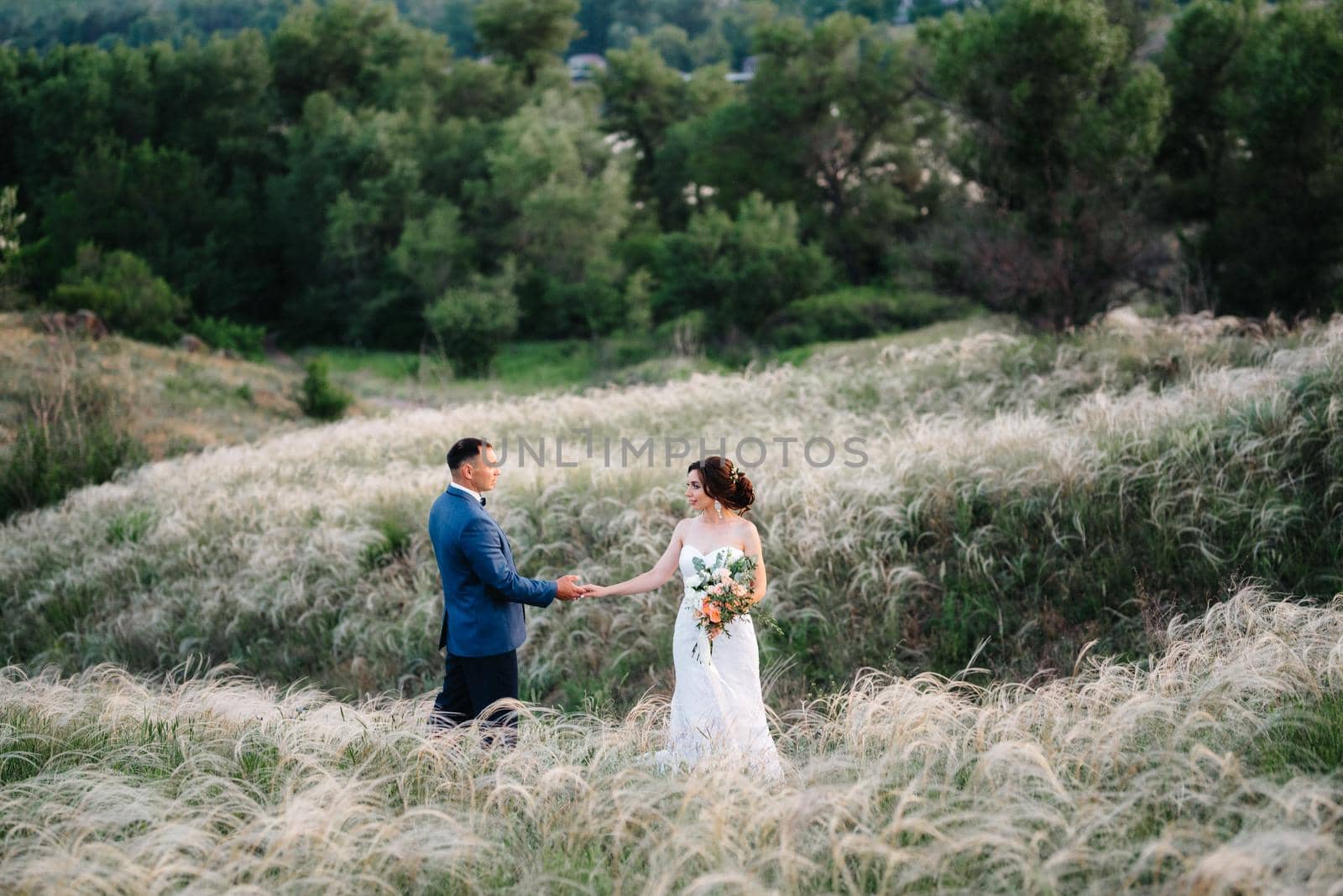 A couple in love a guy and a girl on a walk in the forest belt