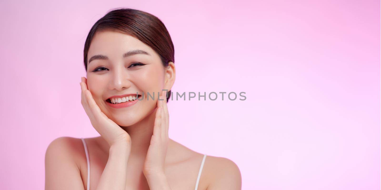 Beautiful asian Spa Girl with empty copy space on pink by makidotvn