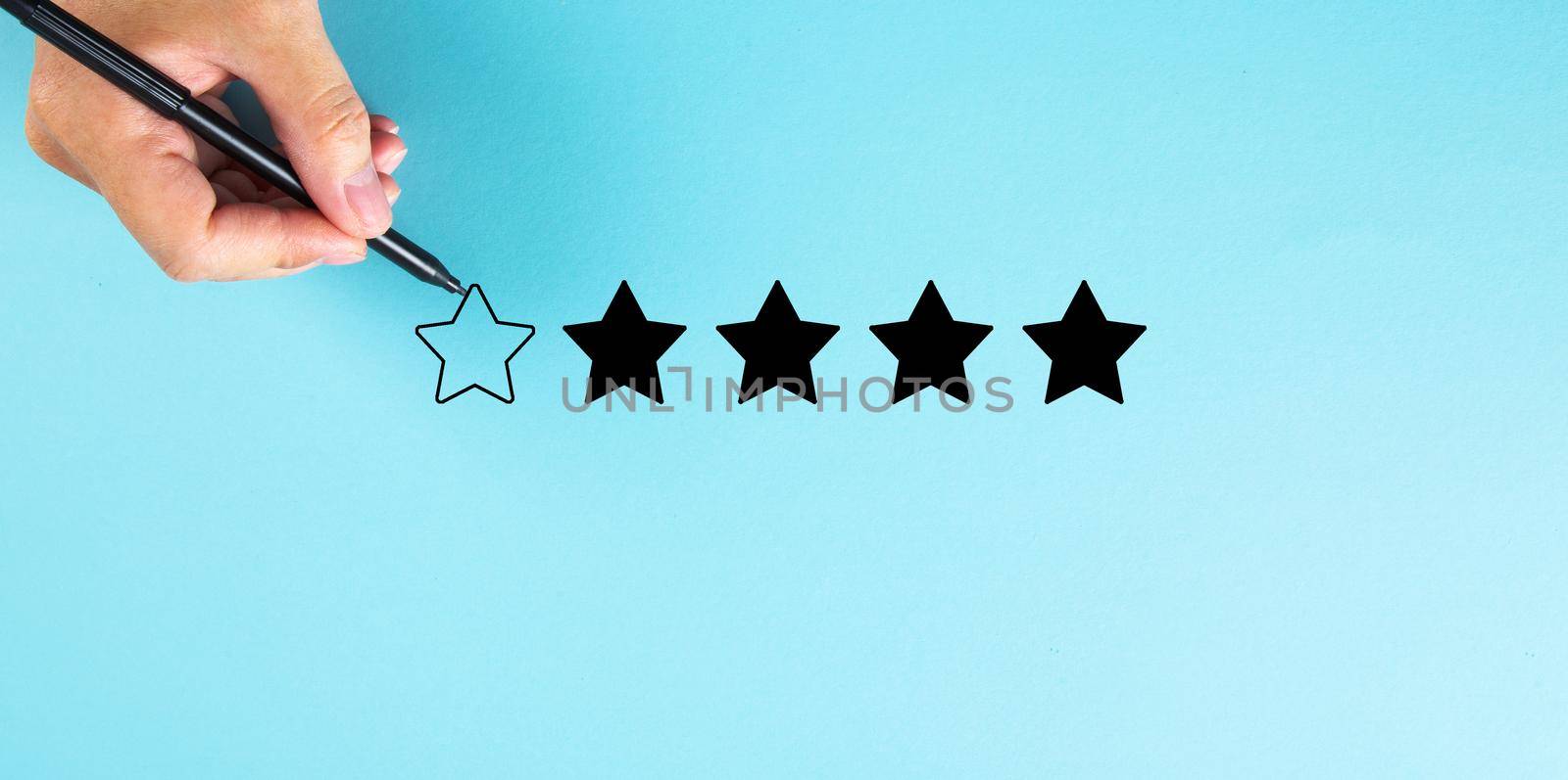 Hand draw a five star rating. evaluation and review concepts