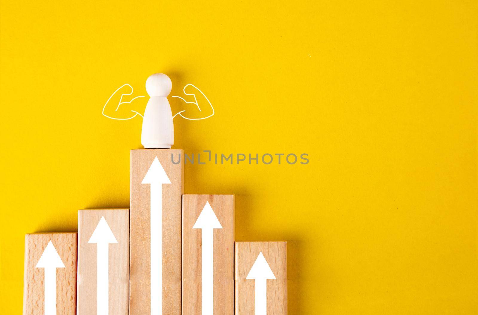 Concept of supremacy leader. Wooden figures on yellow background by tehcheesiong