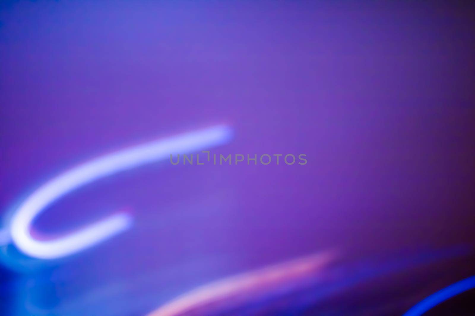 Technology, defocused textures and futuristic design concept - Neon lights background, abstract lines in motion