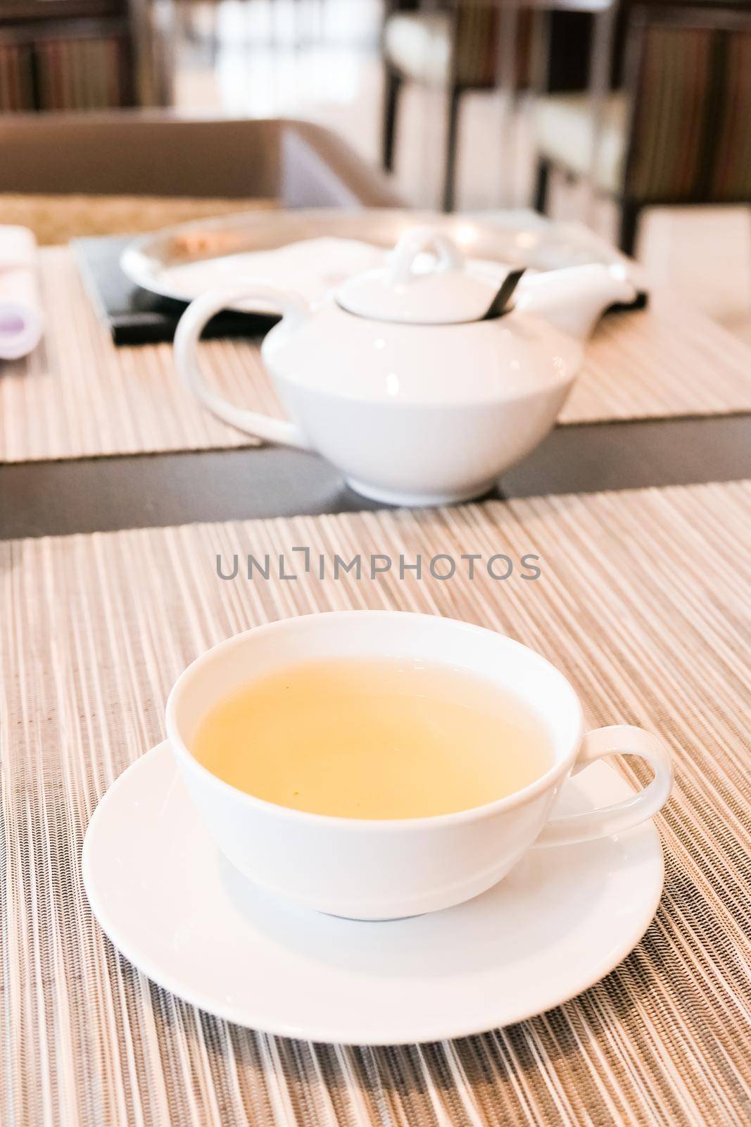Healthy nutrition, relax and detox concept - Green herbal tea in a restaurant, five o'clock