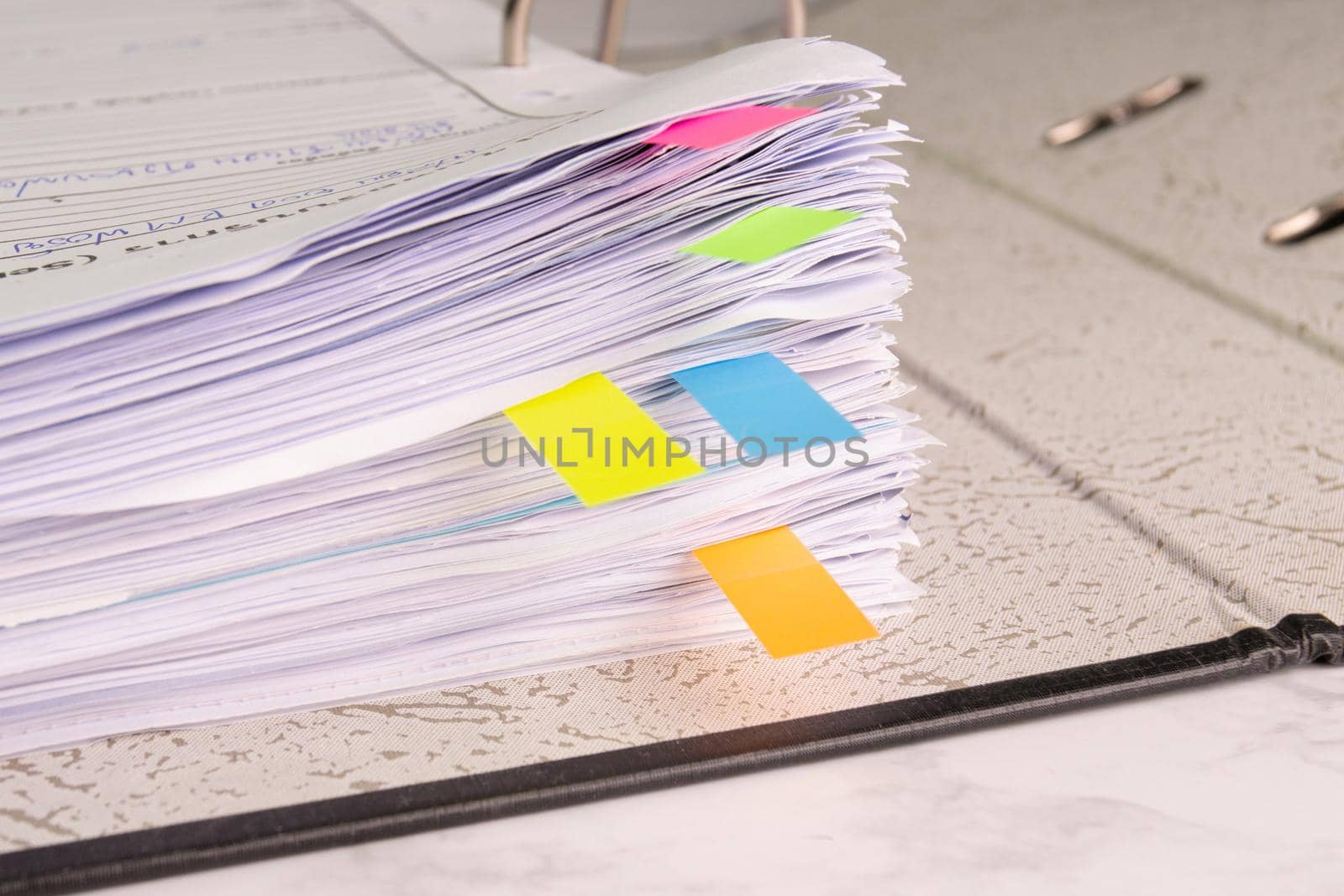 white paper stack in folder file for a business contract, income, expenses  by piyaphun