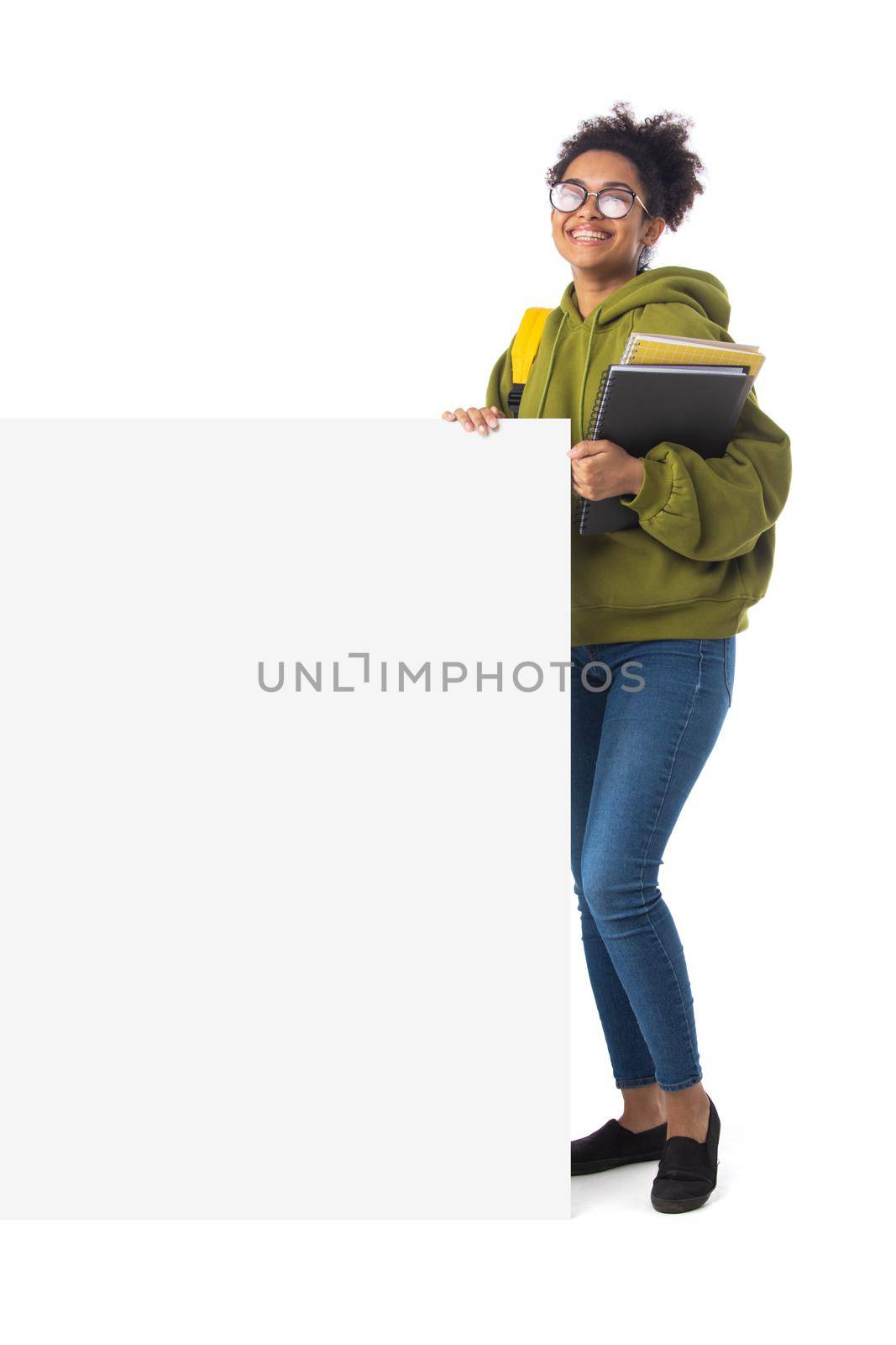 Friendly ethnic black female high school student in eyeglasses with banner and composition book isolated on white background