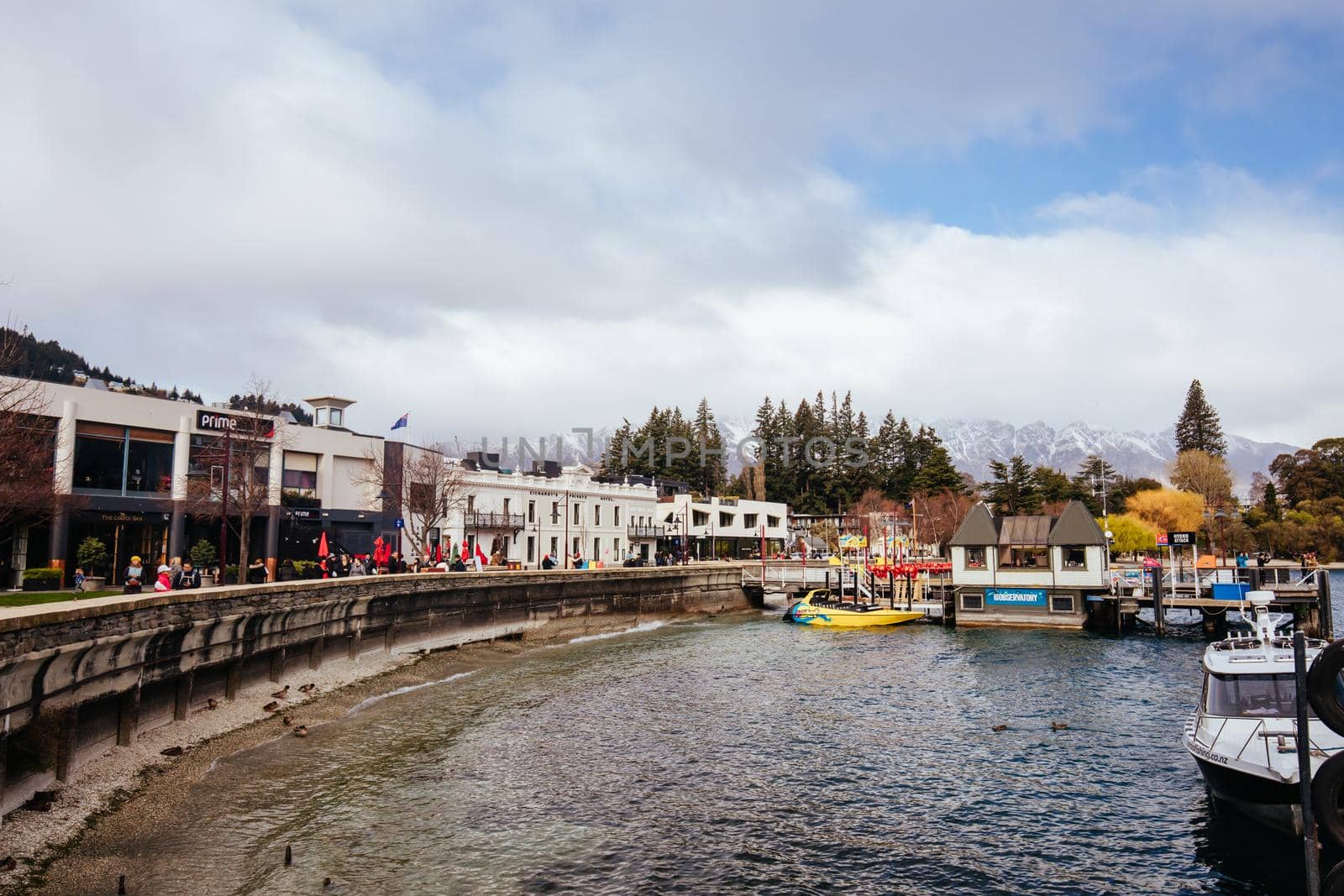 Queenstown, New Zealand - September 26 2019: Downtown Queenstown streets and buildings on a sunny spring day in Otago, New Zealand