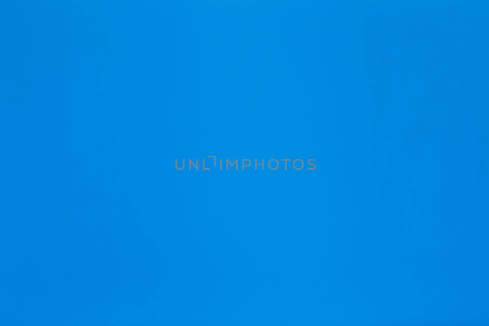 Solid blue paper background with light texture.