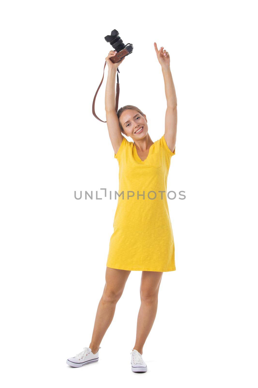 Woman photographer with arms raised, isolated on white background