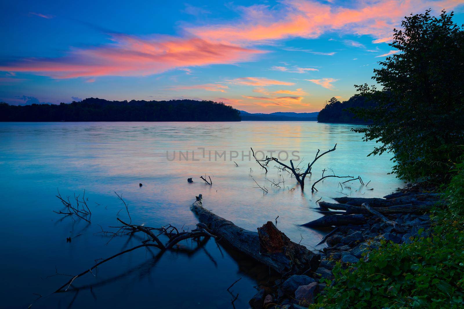 Sunset on Lake Chatuge at Jackrabbit Mountain Recreation Area, NC. by patrickstock