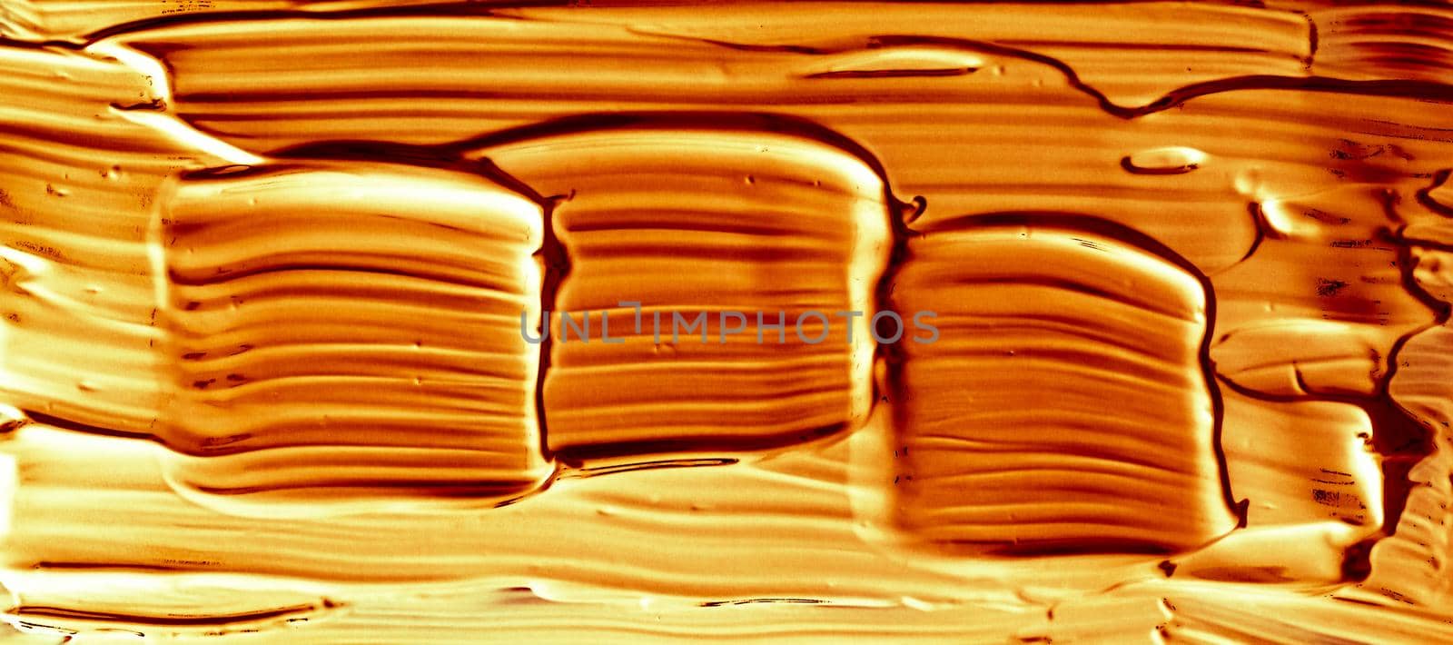 Art abstract, cosmetic product and hand painted design concept - Golden paint brush stroke texture isolated on black background