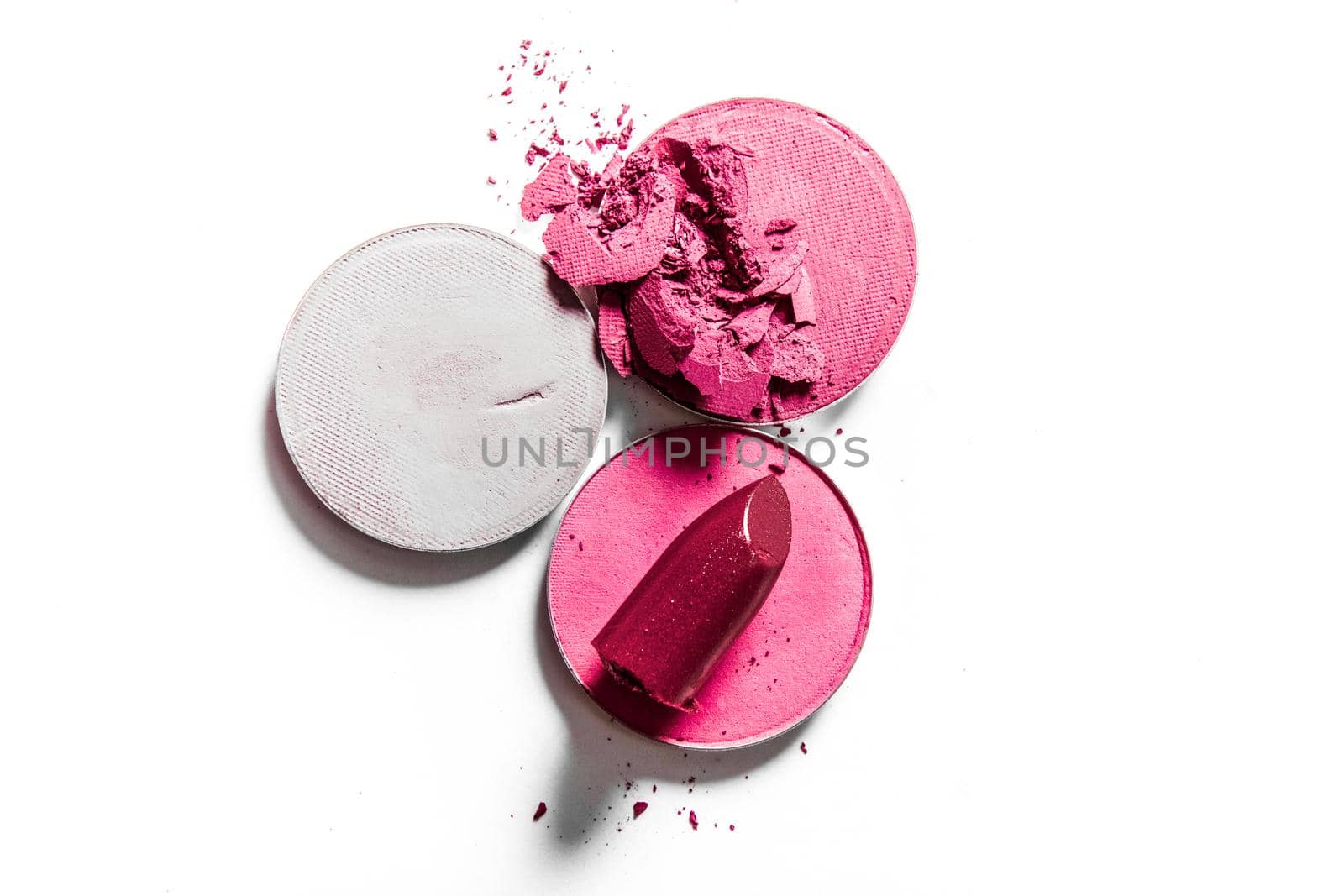 Beauty texture, cosmetic product and art of make-up concept - Crushed eyeshadows and lipstick isolated on white background