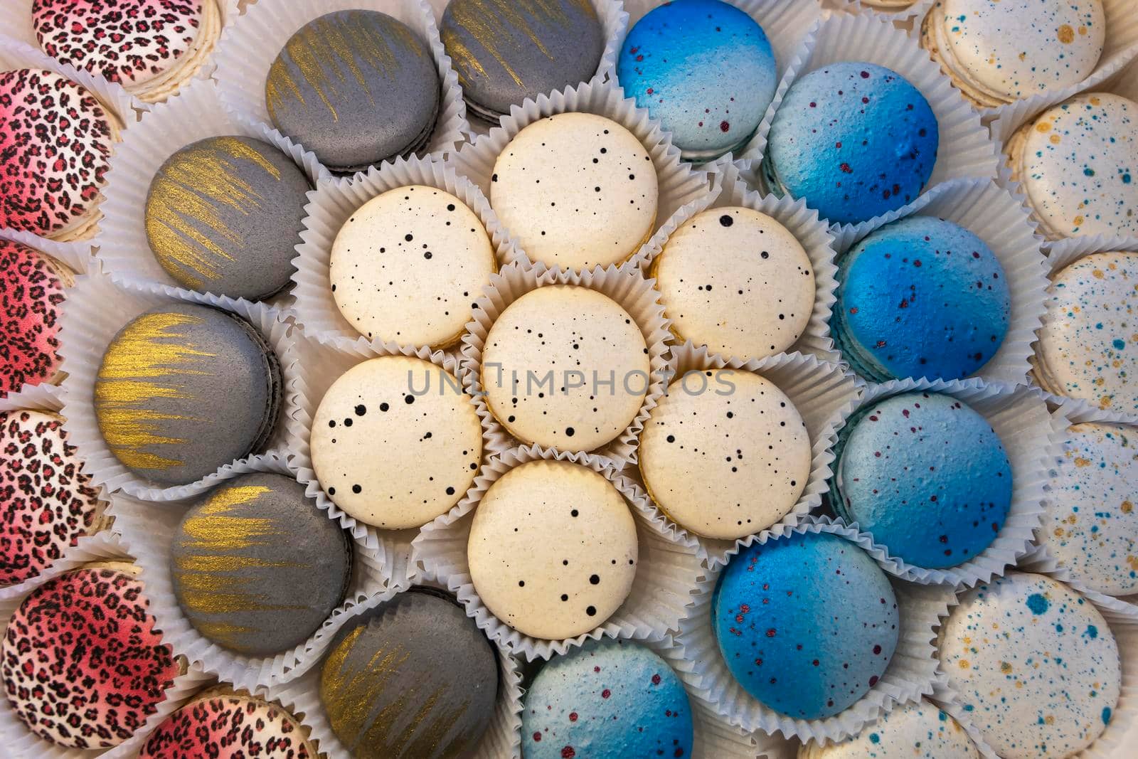 delicious cakes macaroni cookies. Multi-colored macaroni biscuits close-up in a box. Box of fresh colorful French macaroon pastry cookies.