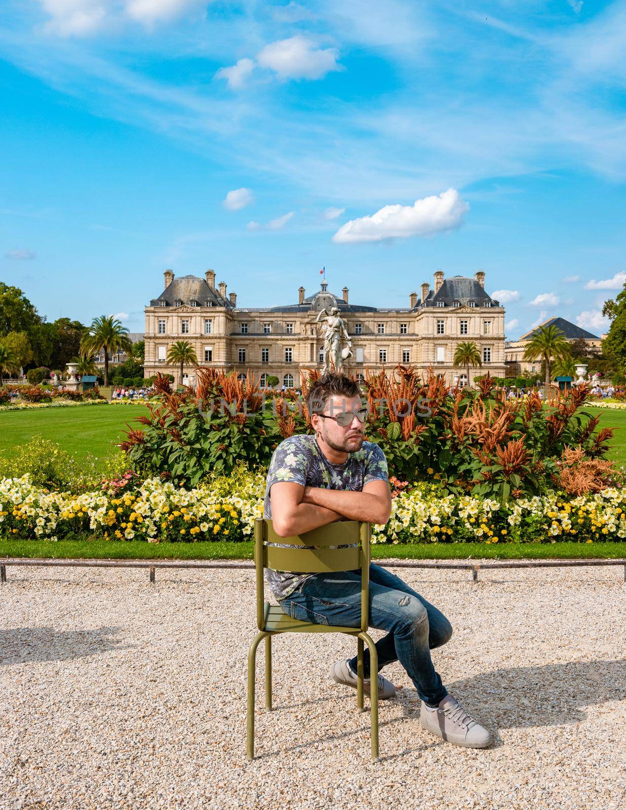 Young men visiting Le Jardin Luxembourg park in Paris during summer in the city of Paris France by fokkebok