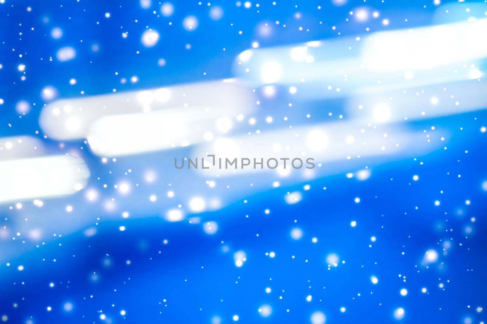 Christmas lights, New Years Eve card and cosmic texture concept - Winter holiday abstract background, glowing snow and magic sparkling shiny glitter