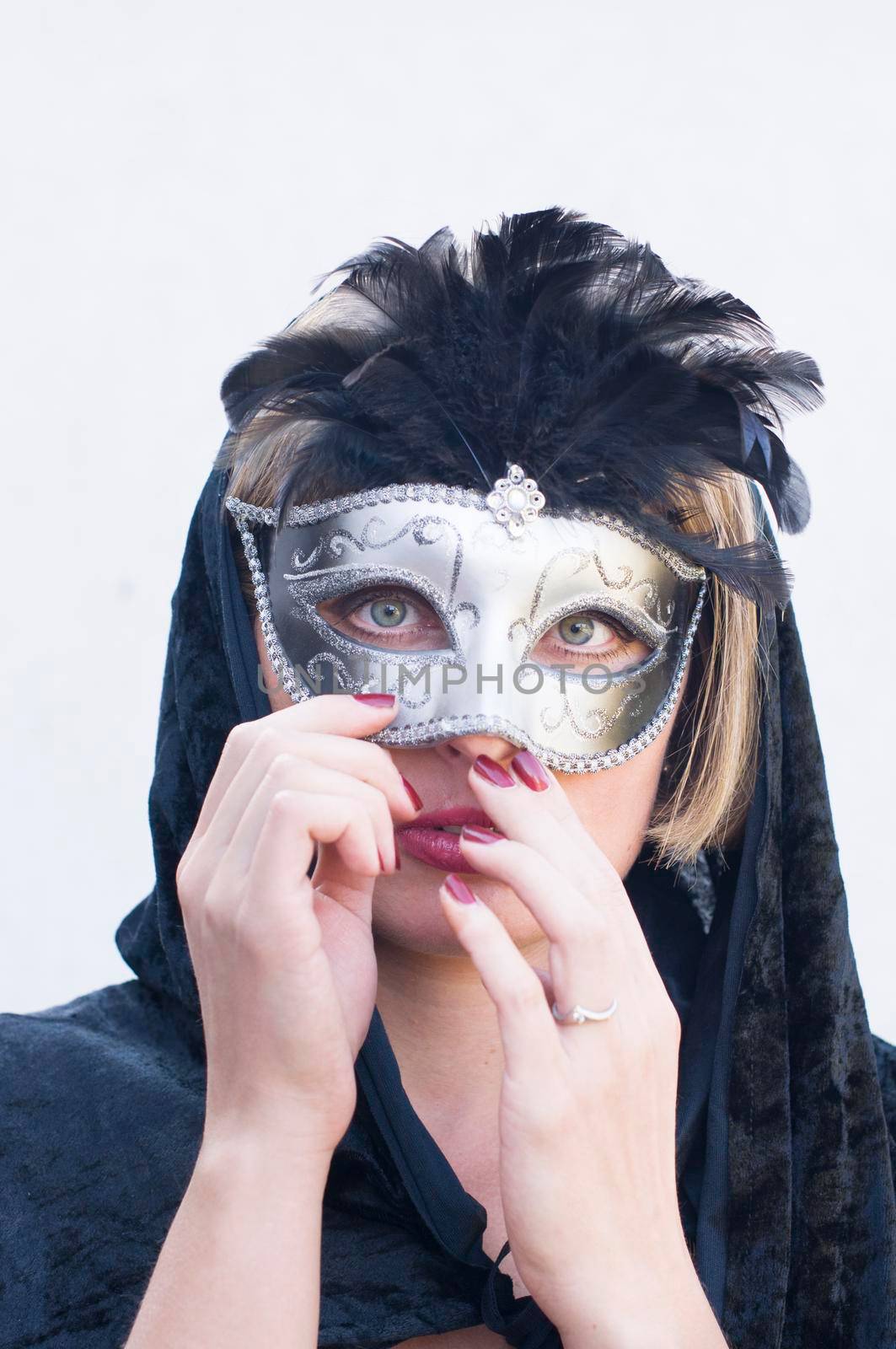 Mysterious Girl in a black cloak and a masquerade mask, mardi gras steampunk mask, a fairy tale, an enchanting story, High quality photo