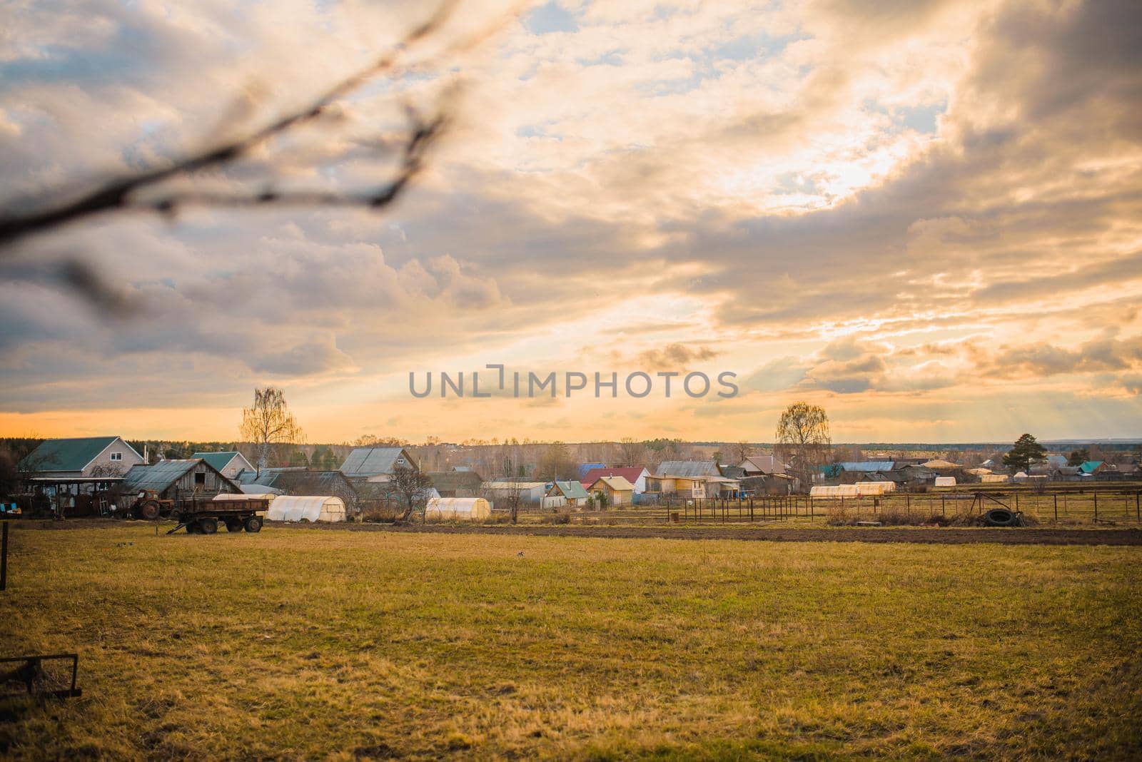 russian village landscape at sunset.