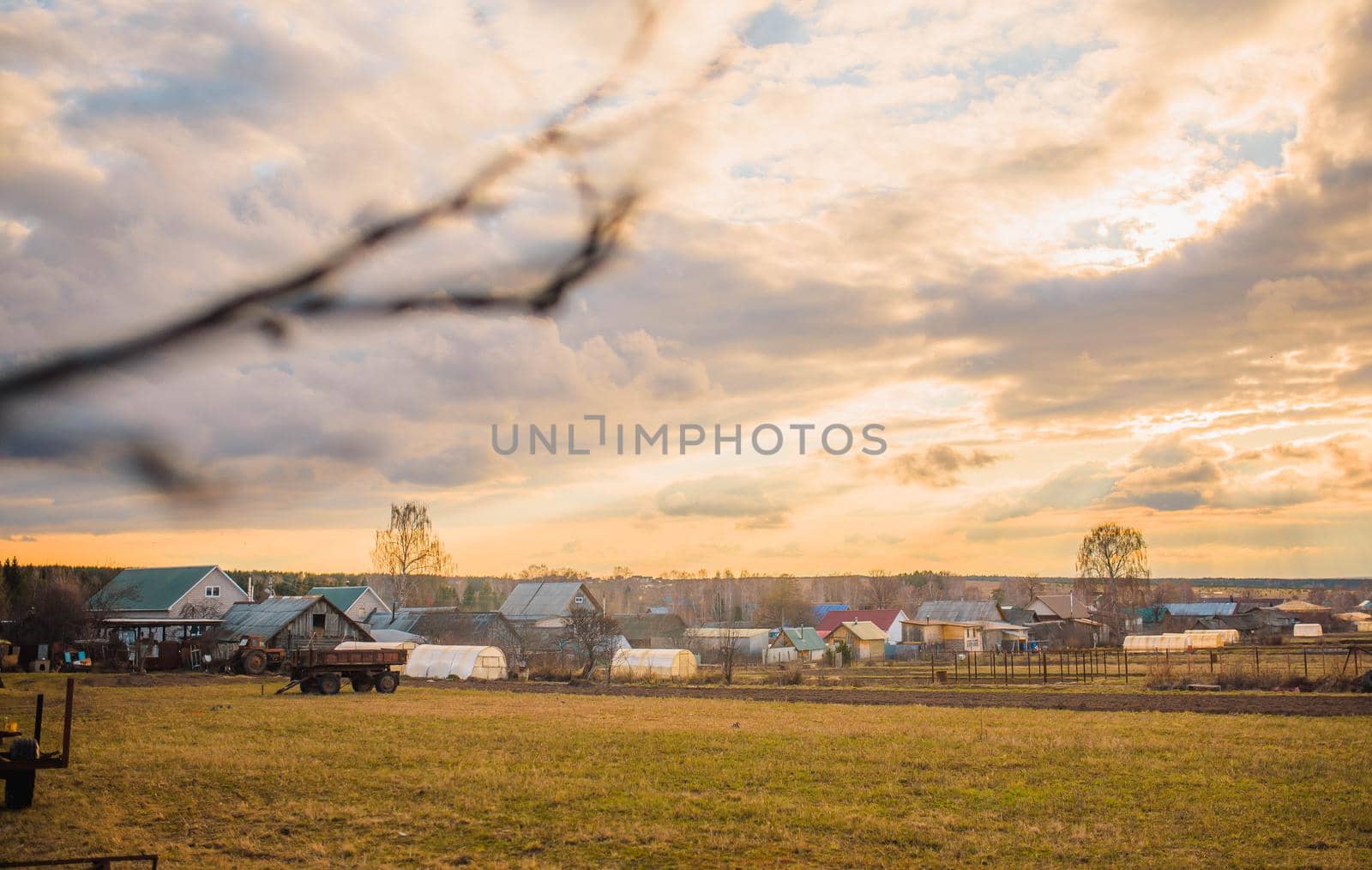 russian village landscape at sunset.