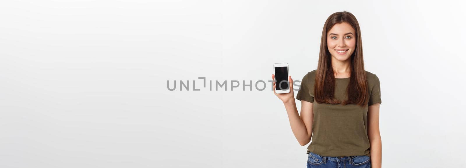 Laughing woman talking and texting on the phone isolated on a white background