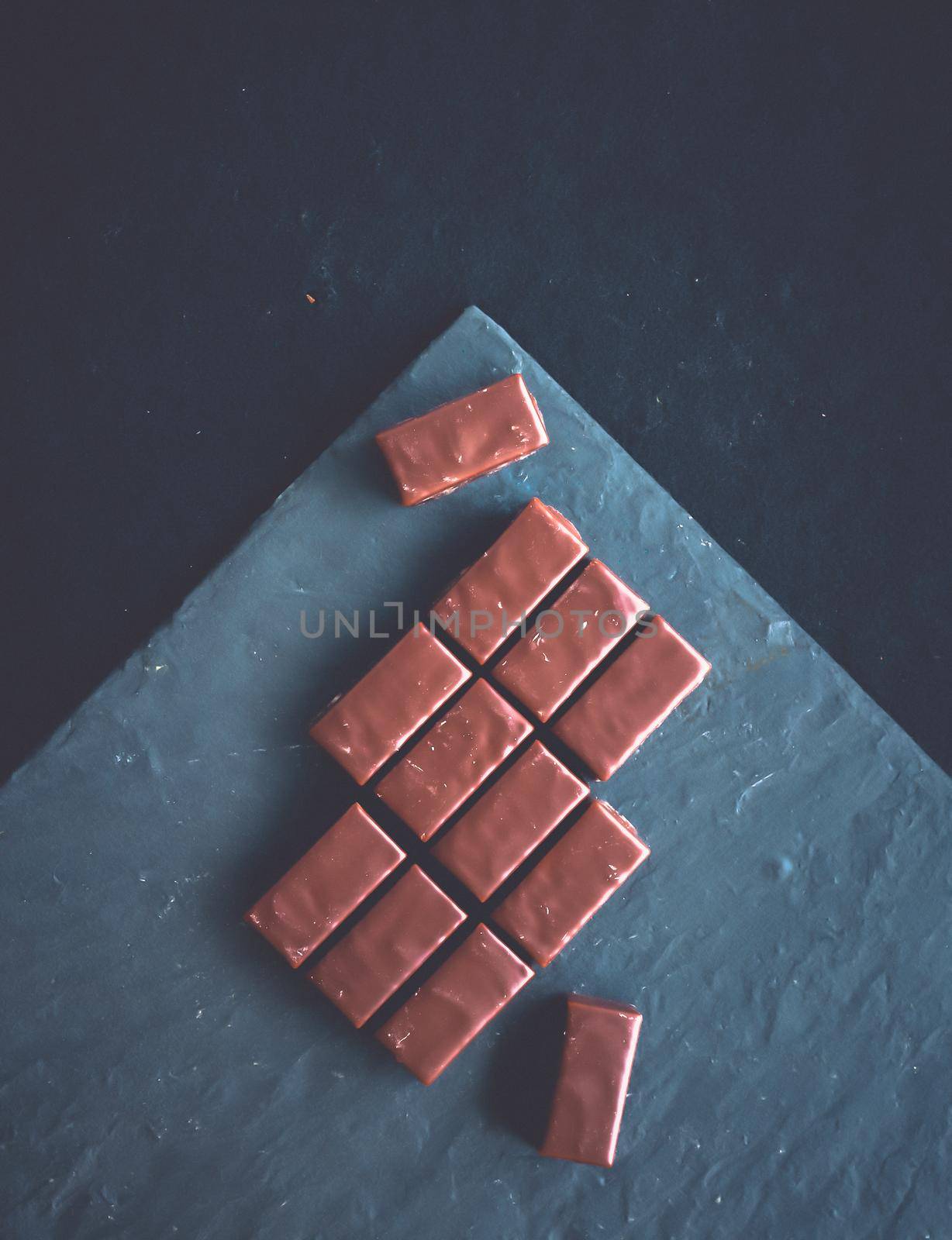 Dessert, confectionery and gluten-free organic food concept - Sweet swiss chocolate candies on a stone tabletop, flatlay