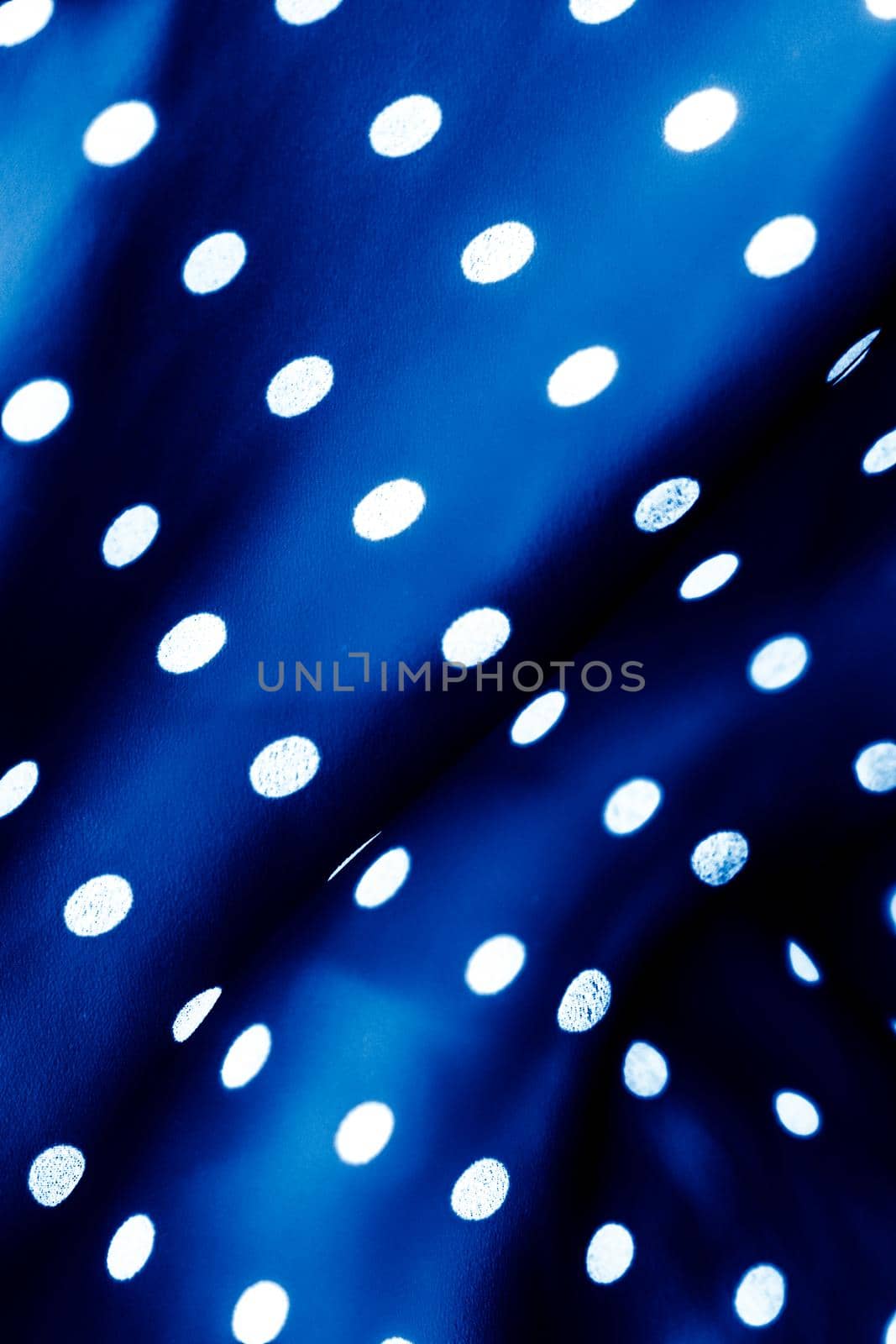 Classic polka dot textile background texture, white dots on blue luxury fabric design pattern by Anneleven