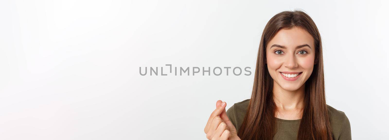 Pretty caucaisan female teenager standing and smiling over white background by Benzoix