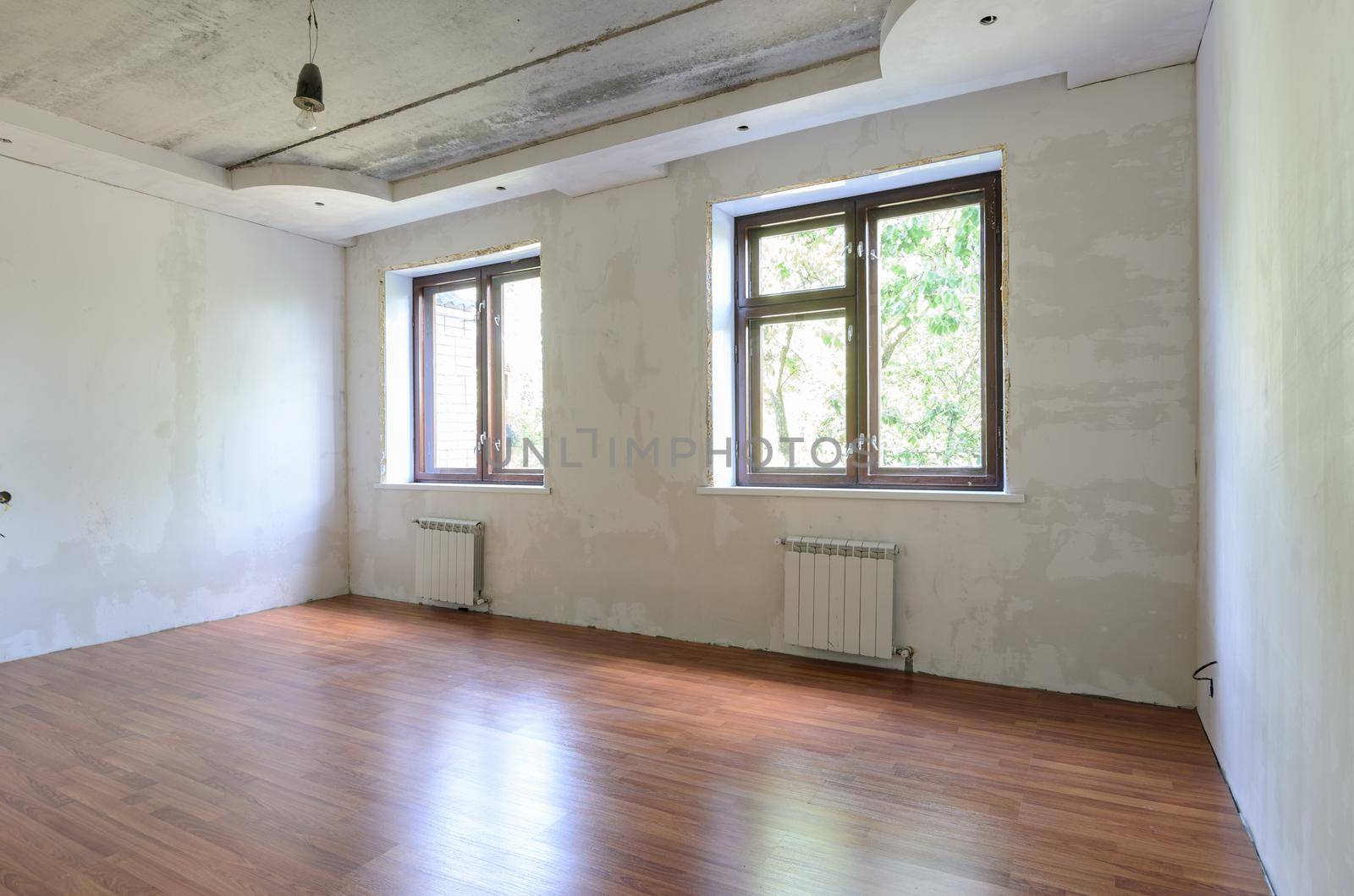 Empty room interior, wall view with windows a