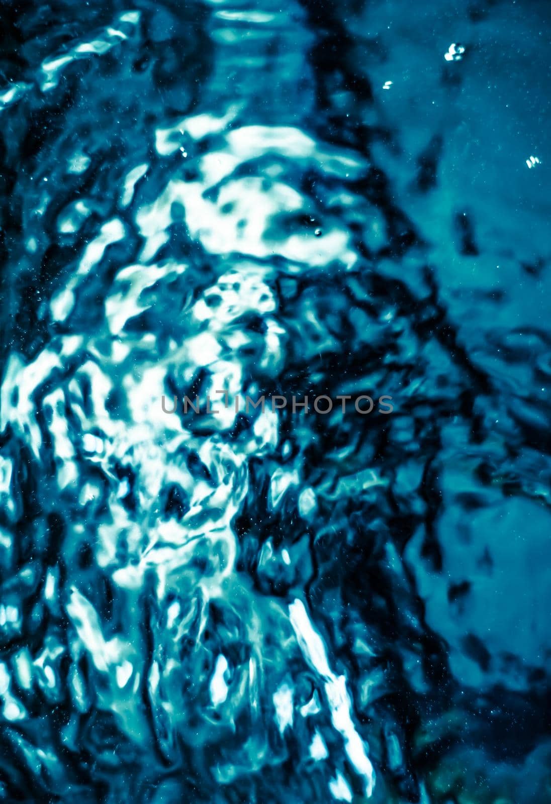 Abstract blue liquid surface as background - futuristic design and science concept. Deep blue waters